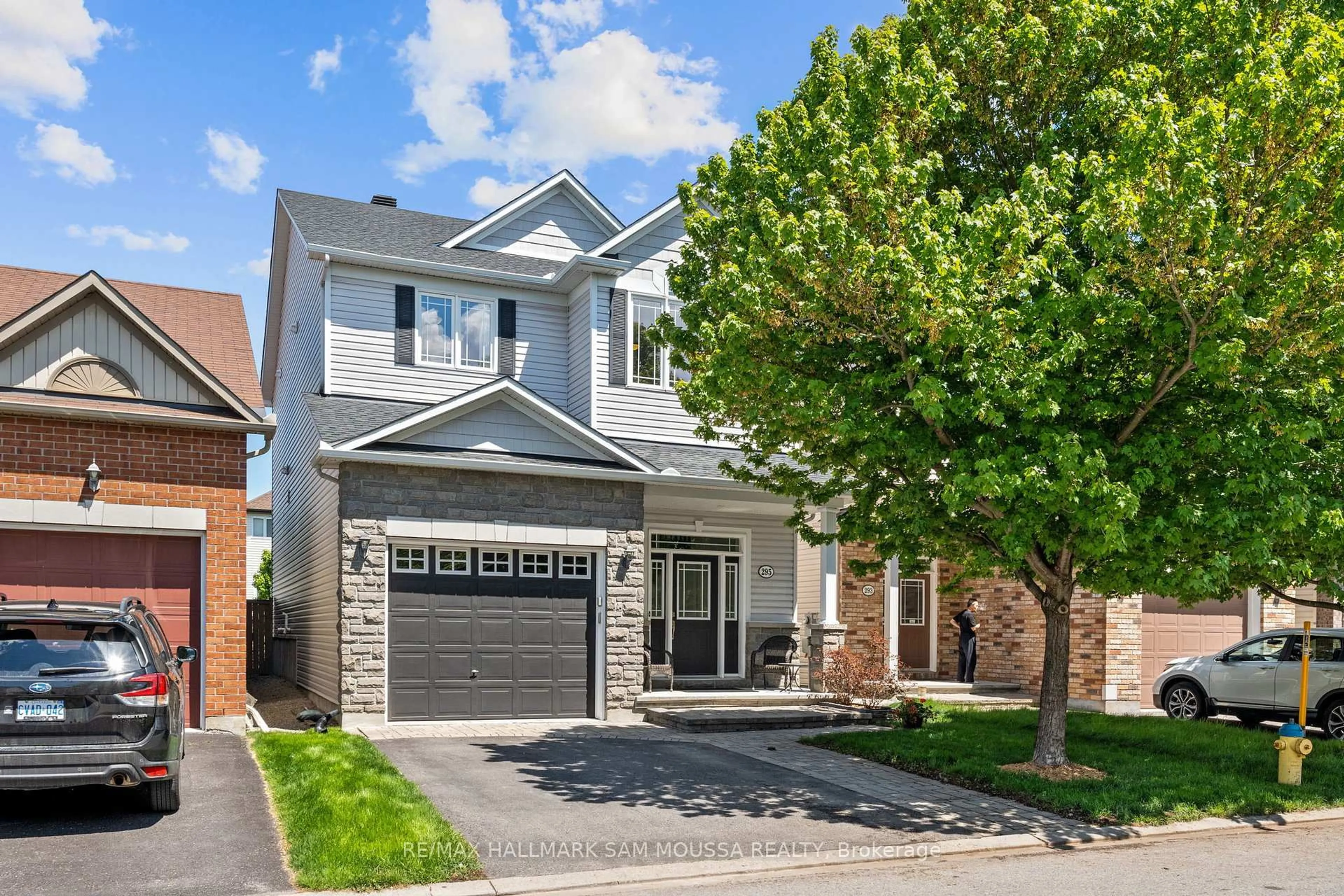 Home with brick exterior material, street for 295 Harthill Way, Ottawa Ontario K2J 0P3
