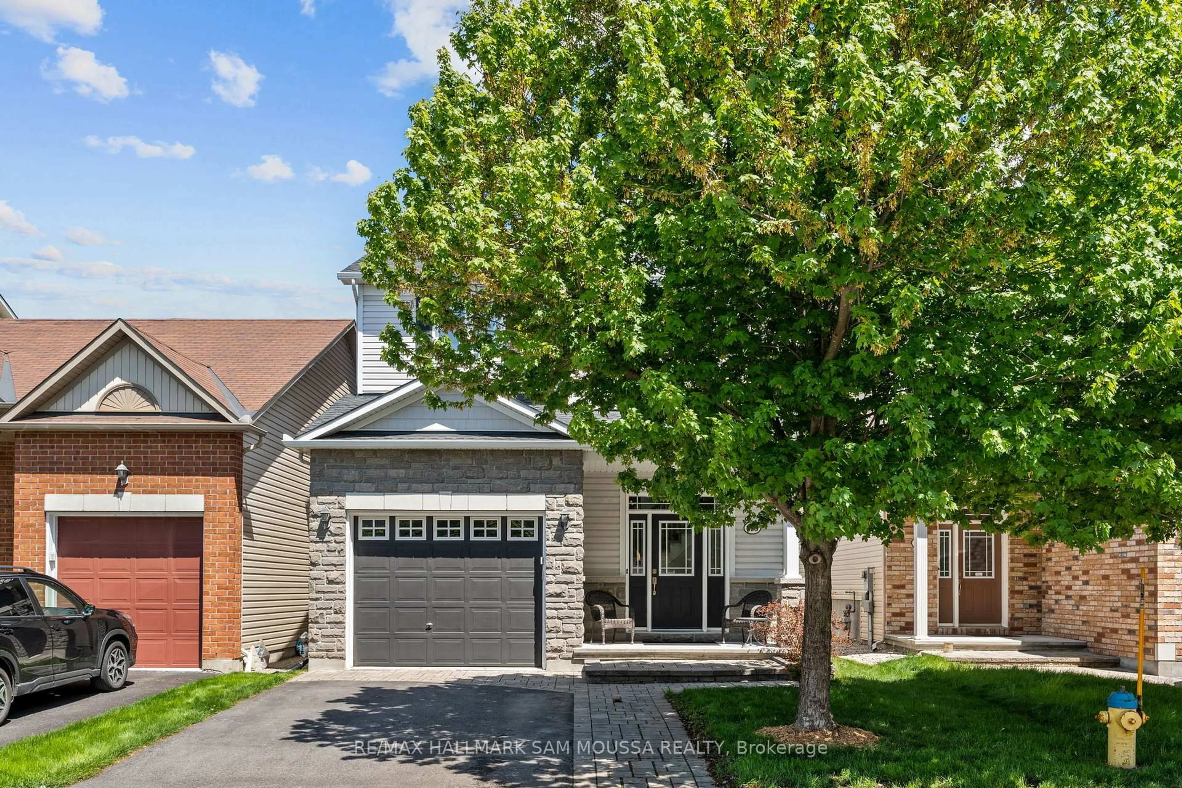 Home with brick exterior material, street for 295 Harthill Way, Ottawa Ontario K2J 0P3
