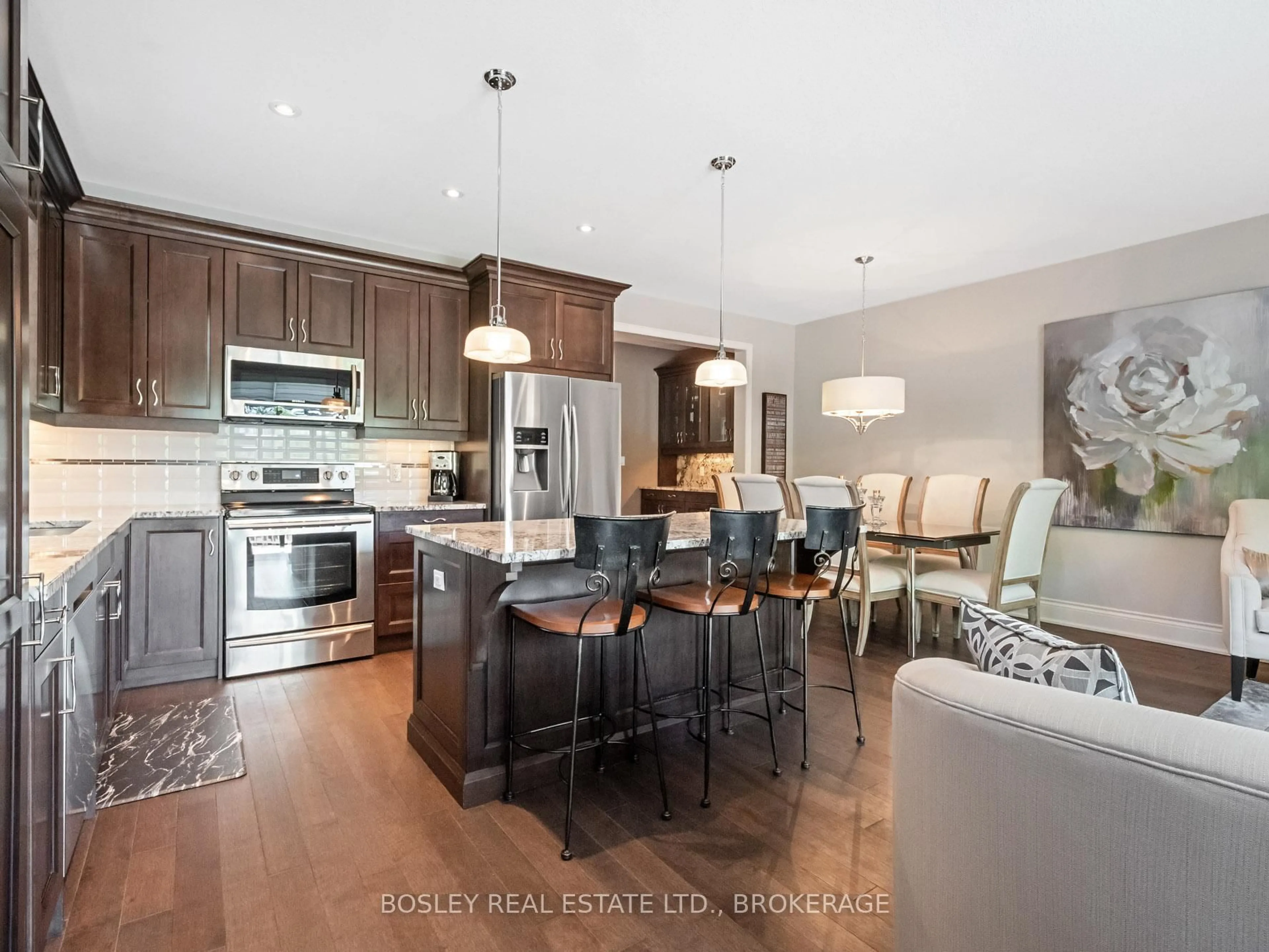 Open concept kitchen, wood/laminate floor for 6855 Freeman St, Niagara Falls Ontario L2E 5T8