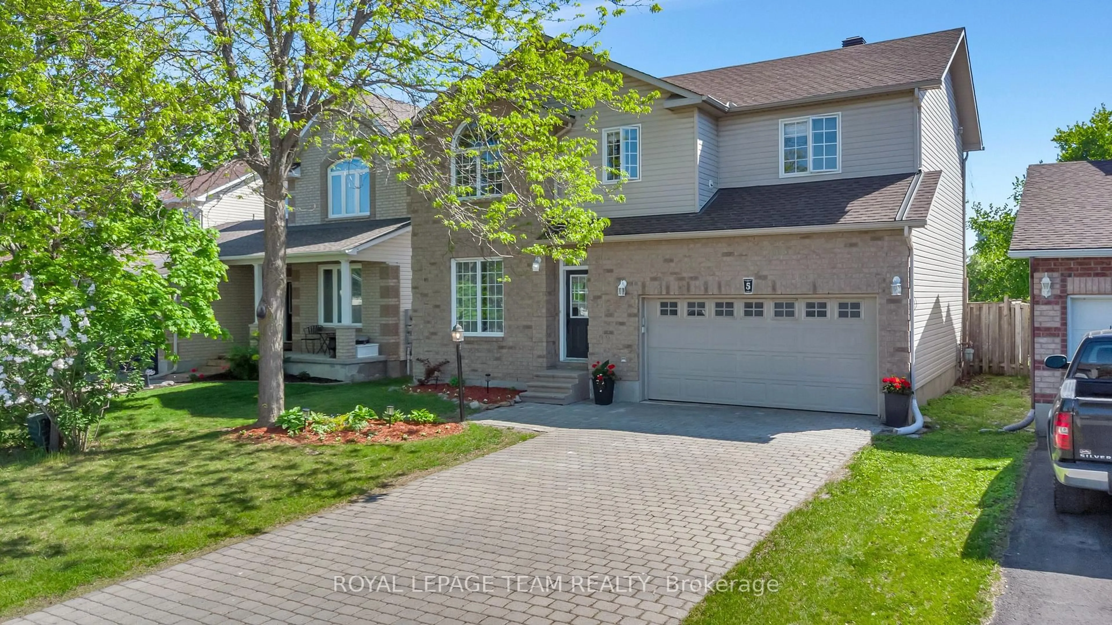 Home with brick exterior material, street for 5 Sundew Crt, Stittsville Ontario K2S 1Z5