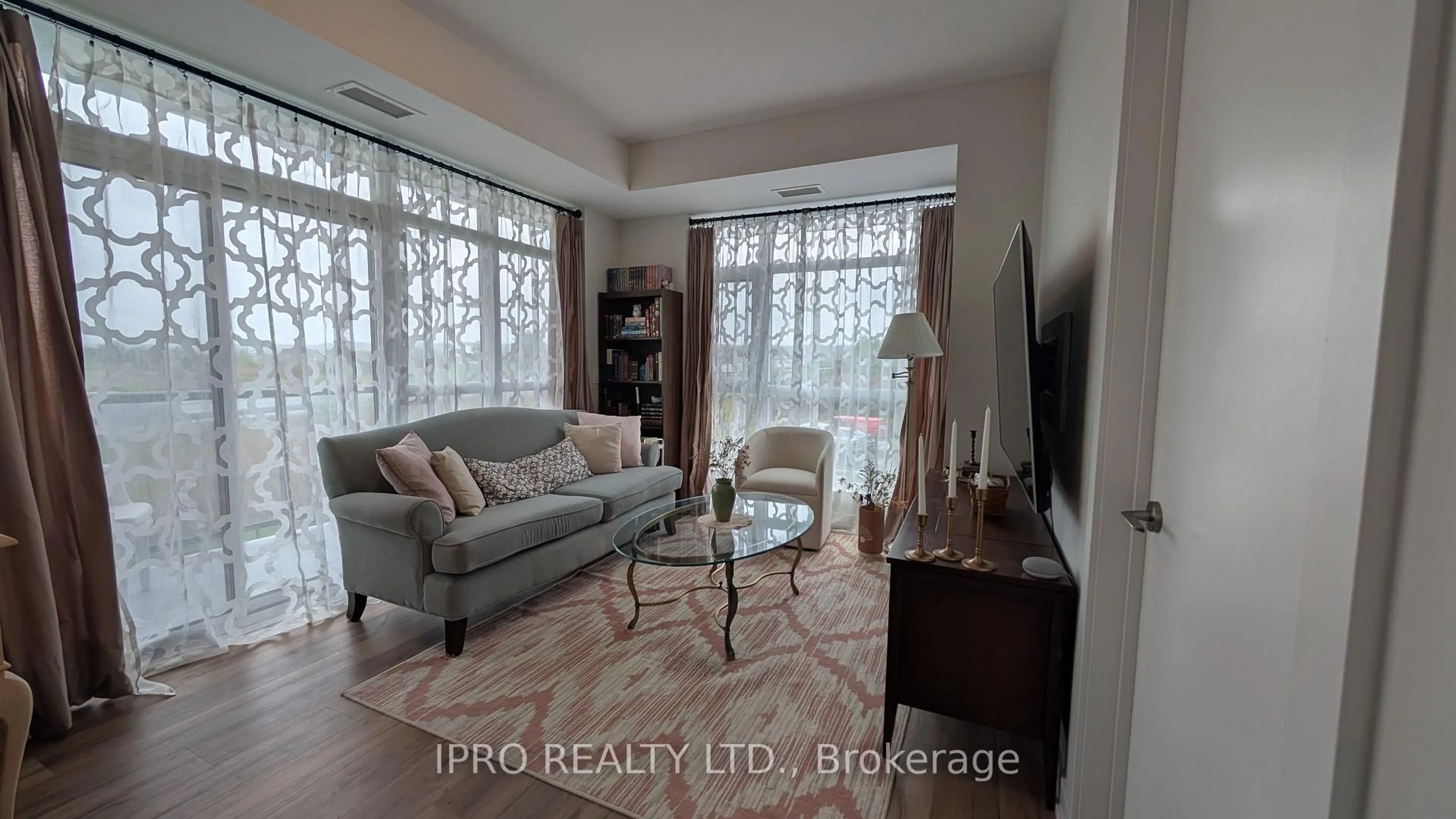Living room with furniture, unknown for 600 North Service Rd #222, Hamilton Ontario L8E 0L2