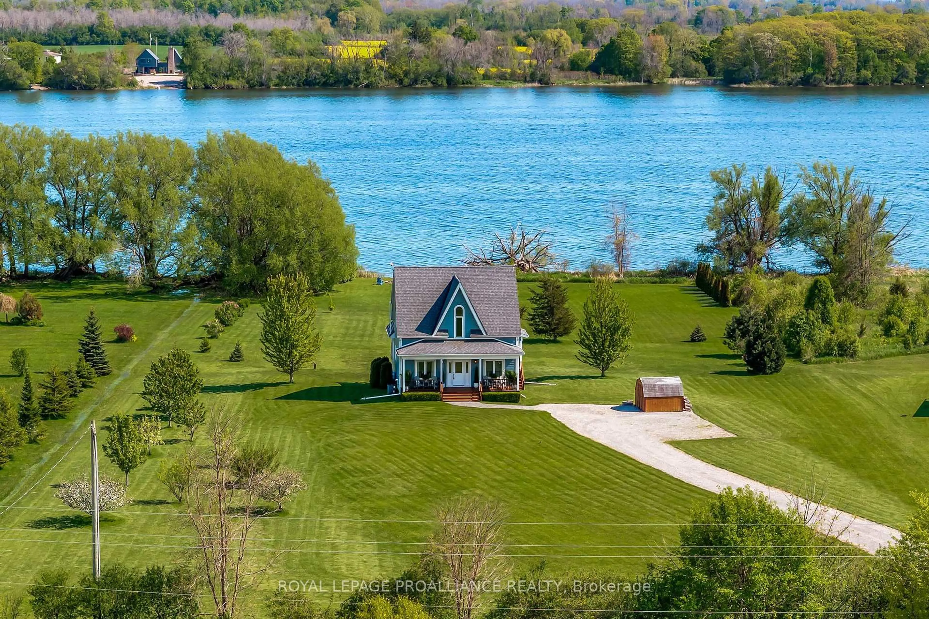 A pic from outside/outdoor area/front of a property/back of a property/a pic from drone, water/lake/river/ocean view for 19337 Loyalist Pkwy, Prince Edward County Ontario K0K 2J0