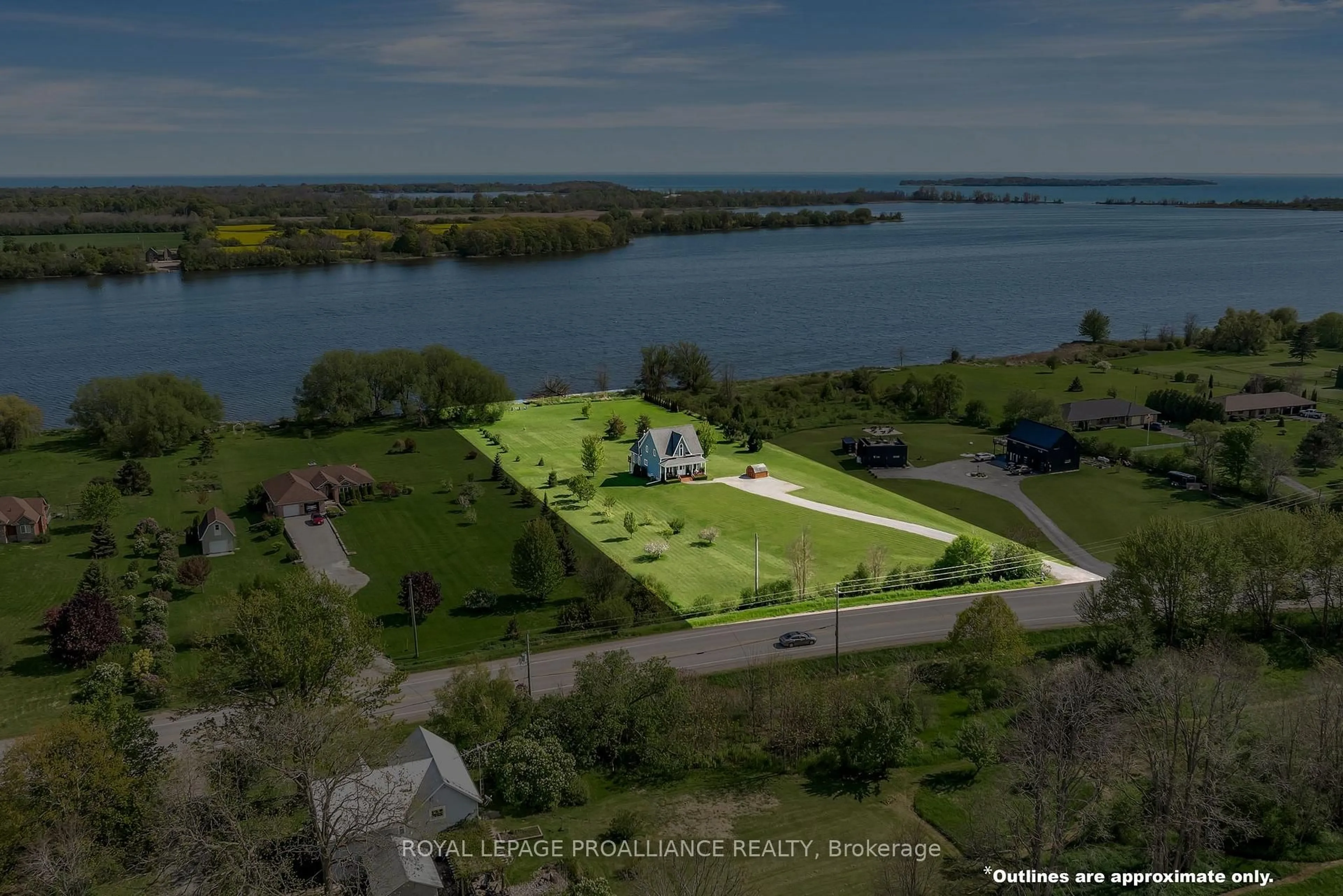 A pic from outside/outdoor area/front of a property/back of a property/a pic from drone, water/lake/river/ocean view for 19337 Loyalist Pkwy, Prince Edward County Ontario K0K 2J0