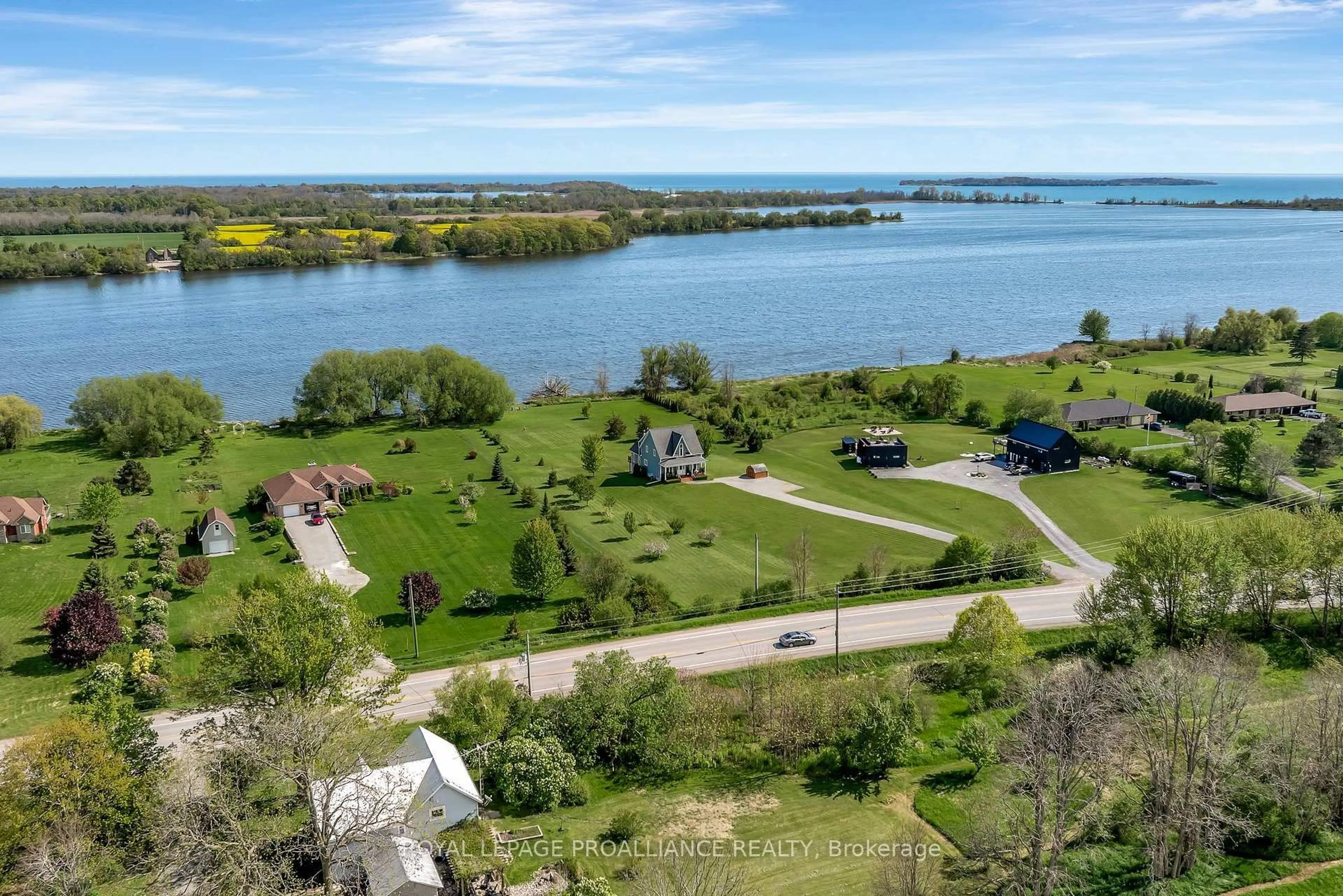 A pic from outside/outdoor area/front of a property/back of a property/a pic from drone, water/lake/river/ocean view for 19337 Loyalist Pkwy, Prince Edward County Ontario K0K 2J0