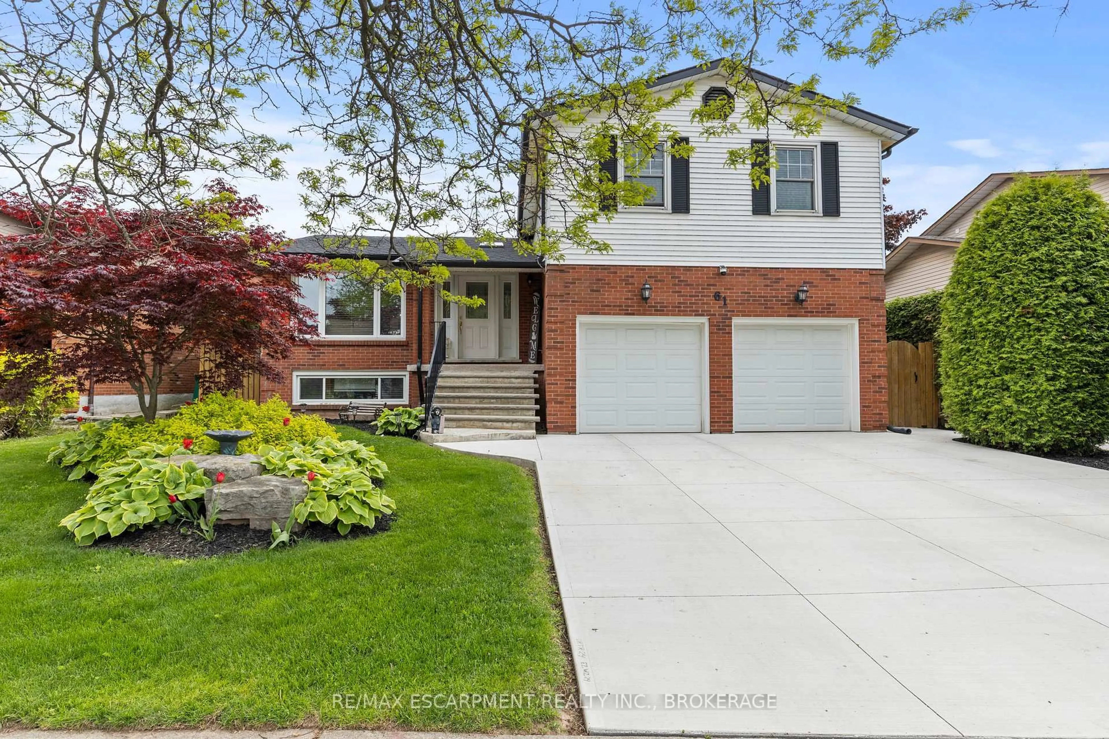 Home with brick exterior material, street for 61 Seaton Place Dr, Hamilton Ontario L8E 4A8