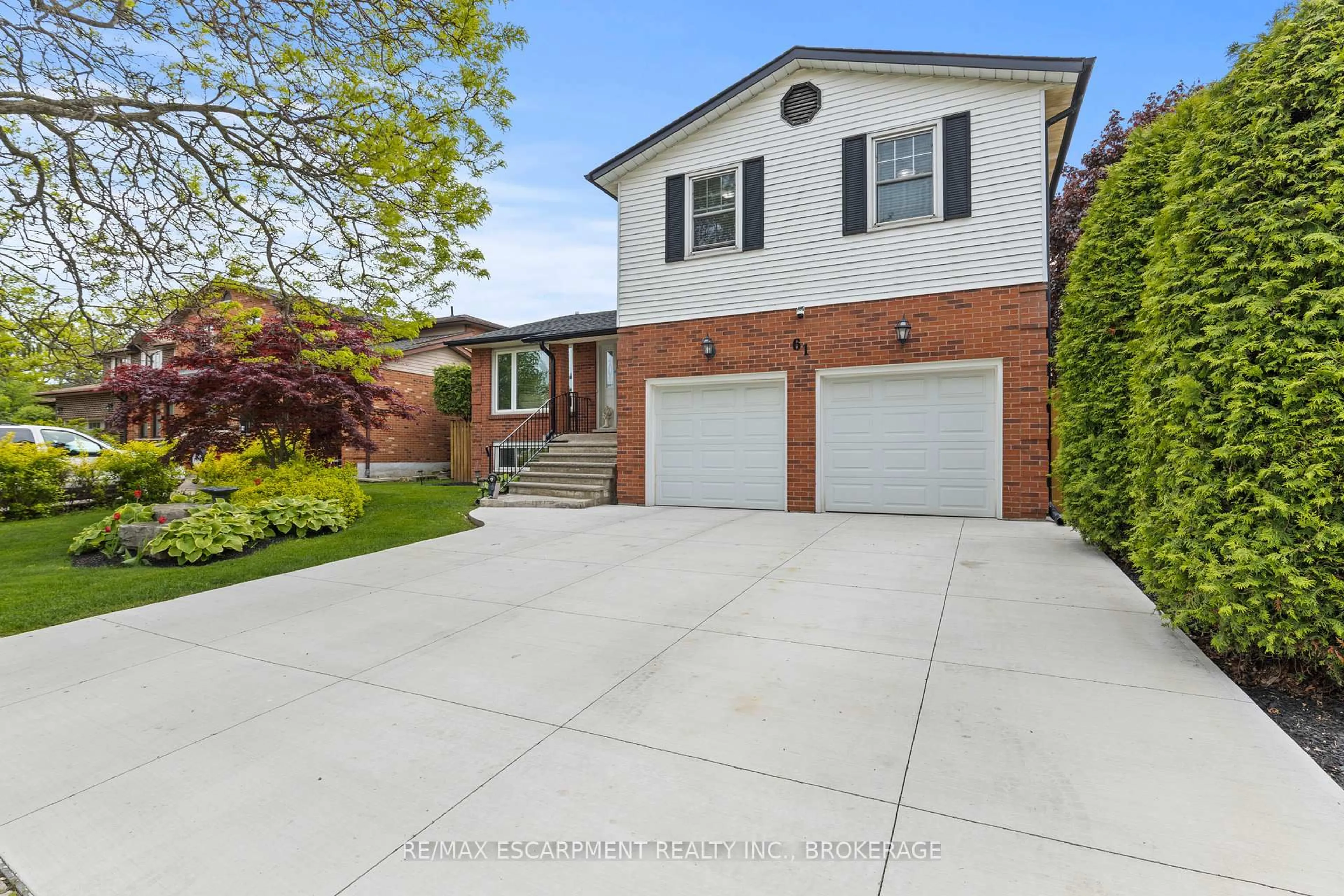 Home with brick exterior material, street for 61 Seaton Place Dr, Hamilton Ontario L8E 4A8