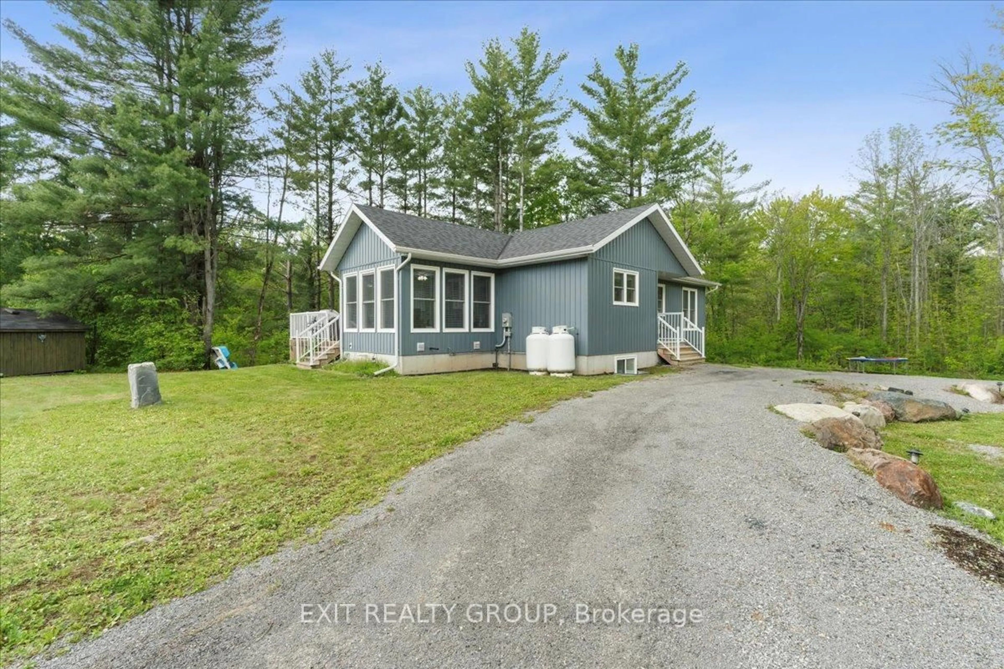 A pic from outside/outdoor area/front of a property/back of a property/a pic from drone, unknown for 3 Quail Ridge Lane, Tweed Ontario K0K 3J0