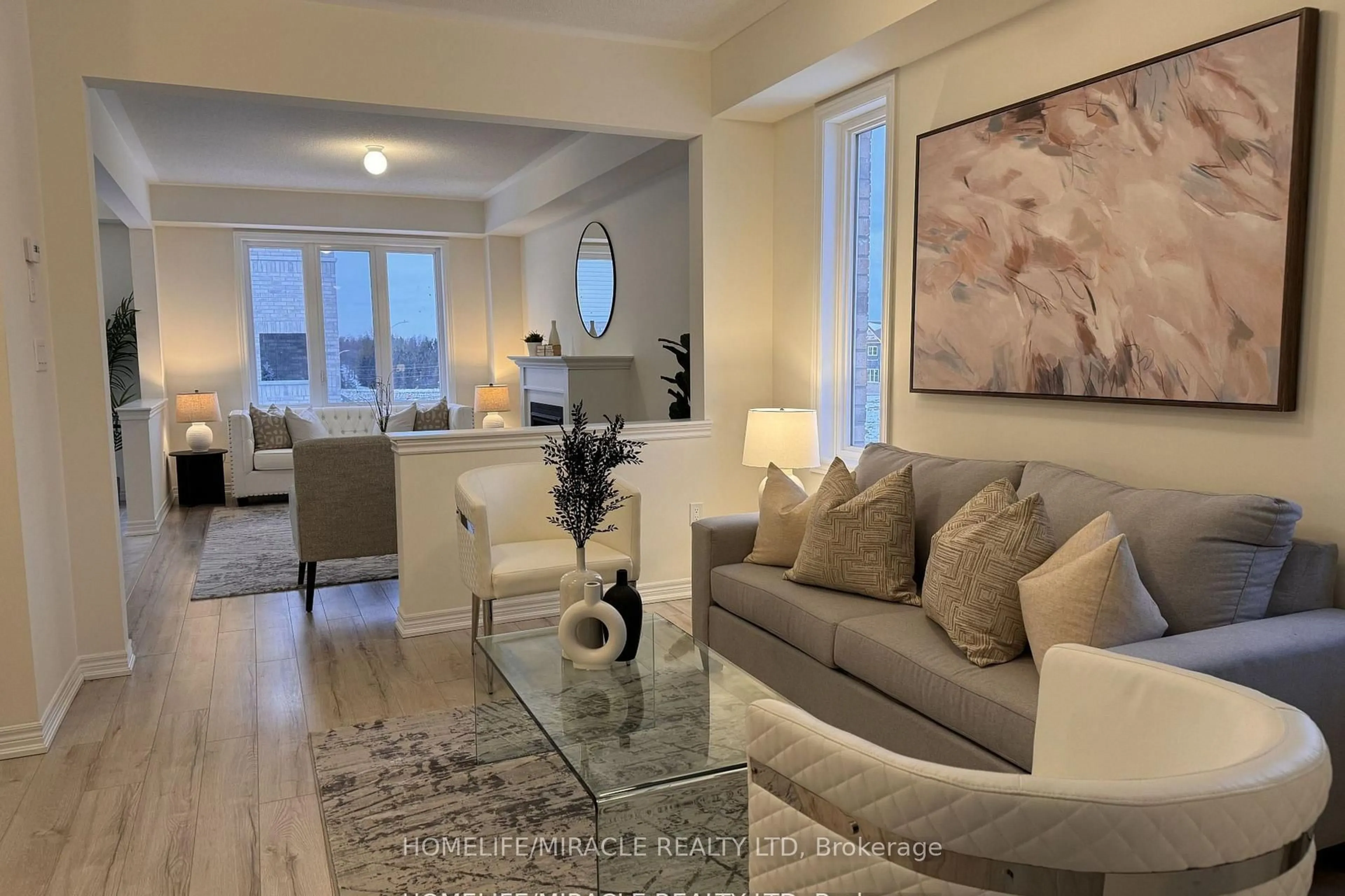 Living room with furniture, wood/laminate floor for 916 Bamford Terr, Peterborough North Ontario K9K 0G3
