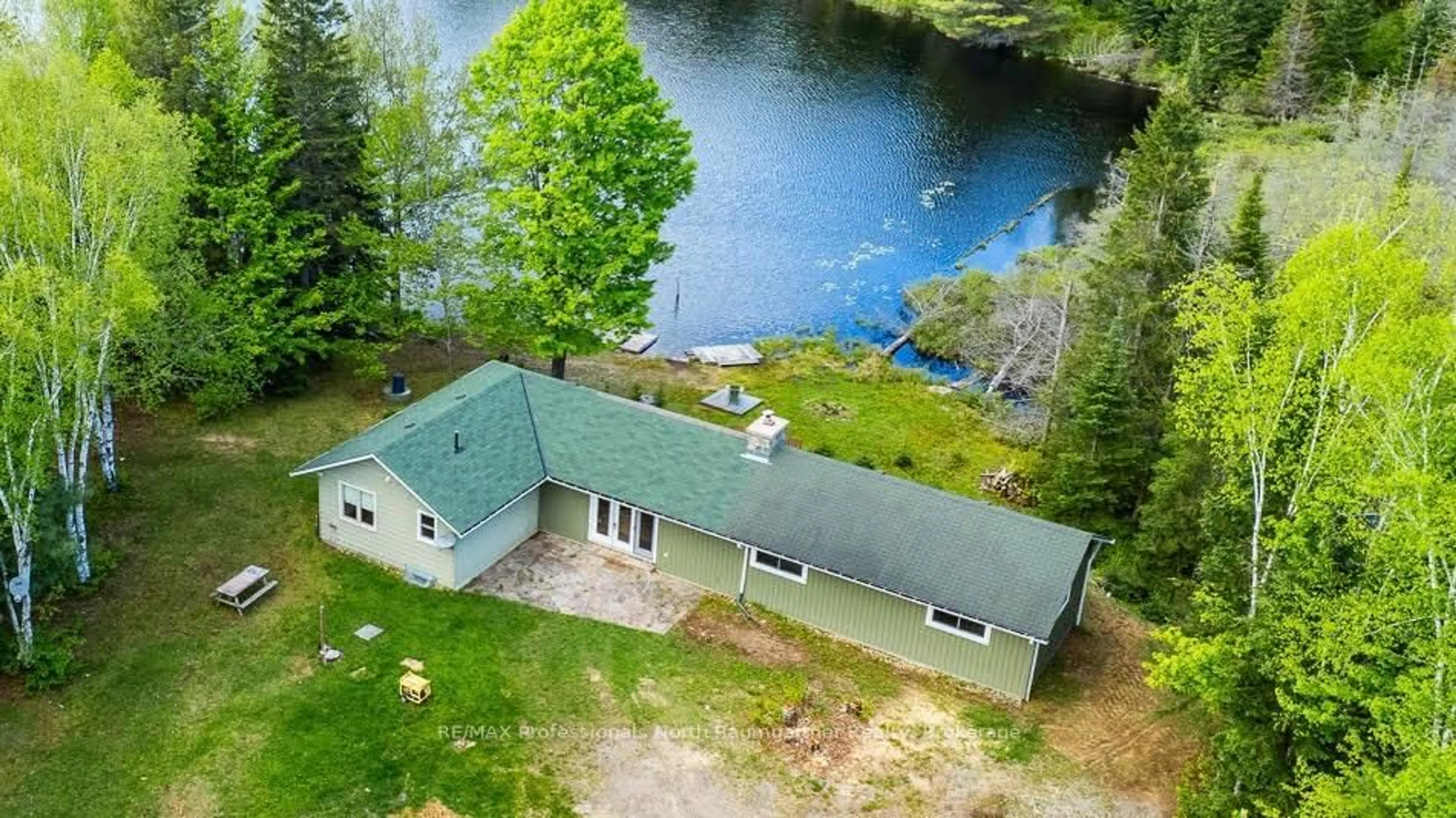 A pic from outside/outdoor area/front of a property/back of a property/a pic from drone, water/lake/river/ocean view for 1080 Queen's Line Rd, Minden Hills Ontario K0M 2K0