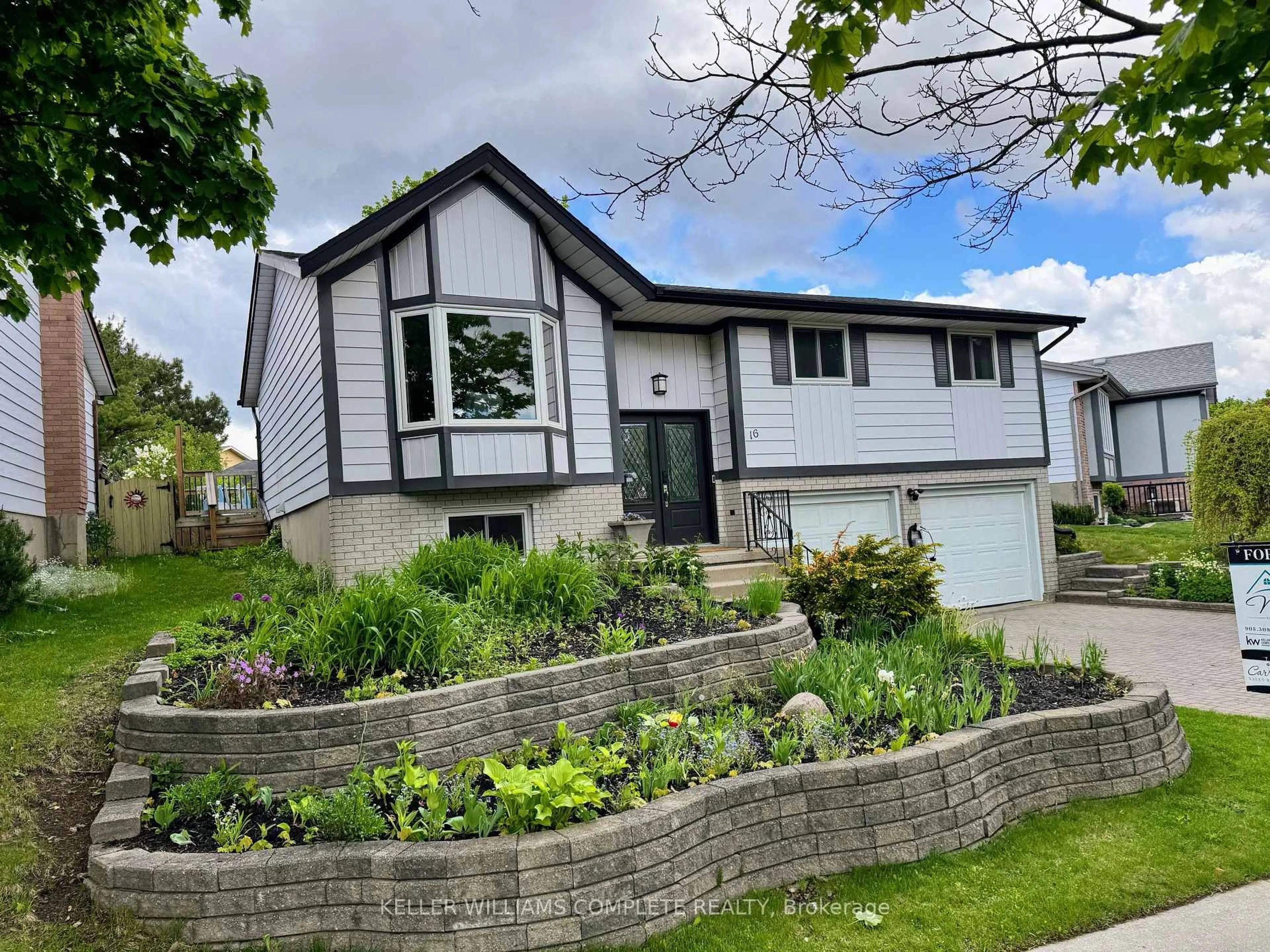 Home with vinyl exterior material, street for 16 Settlers Dr, Kitchener Ontario N2E 2L3
