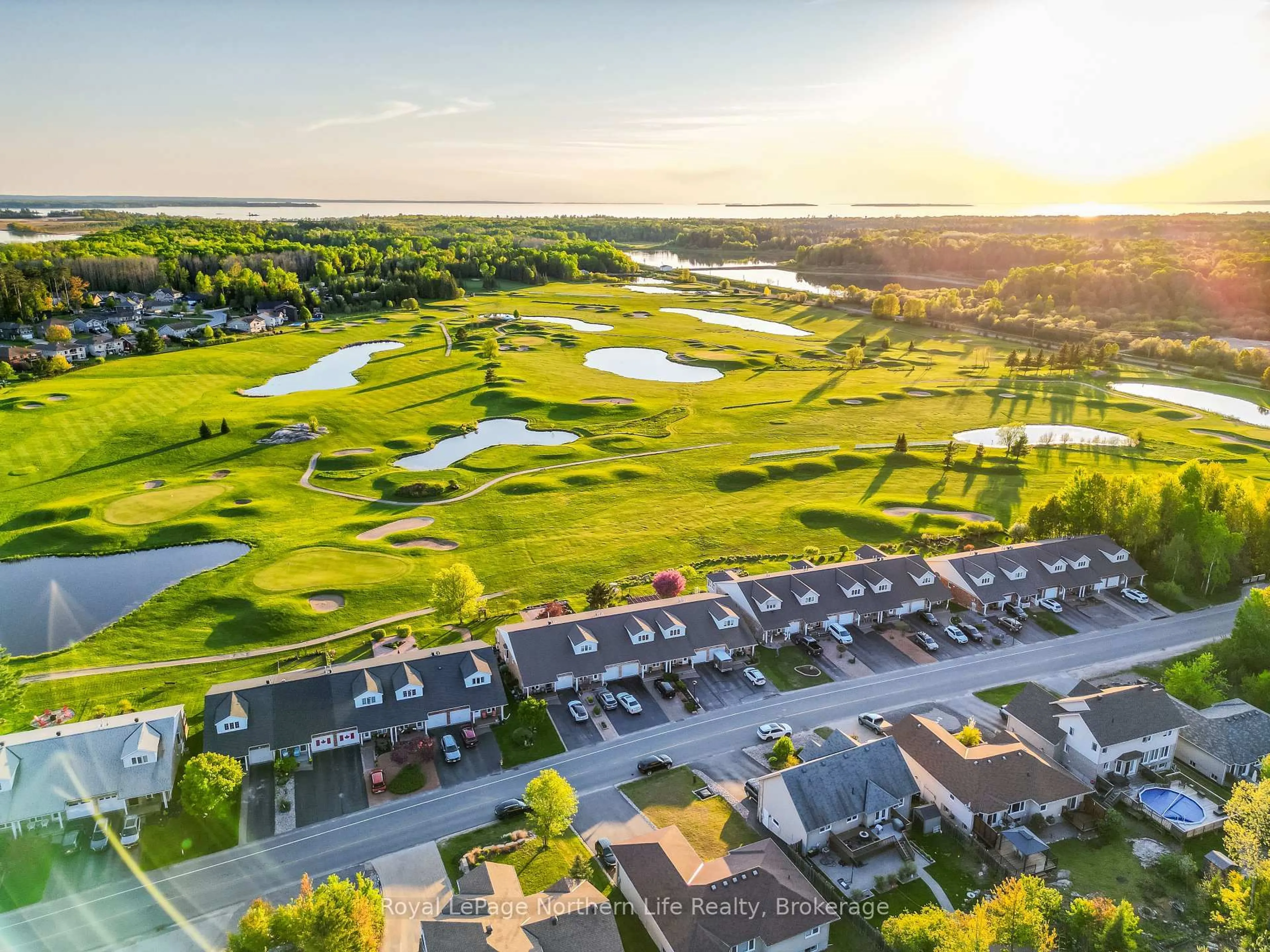 A pic from outside/outdoor area/front of a property/back of a property/a pic from drone, water/lake/river/ocean view for 109 Fairway Dr, Callander Ontario P0H 1H0