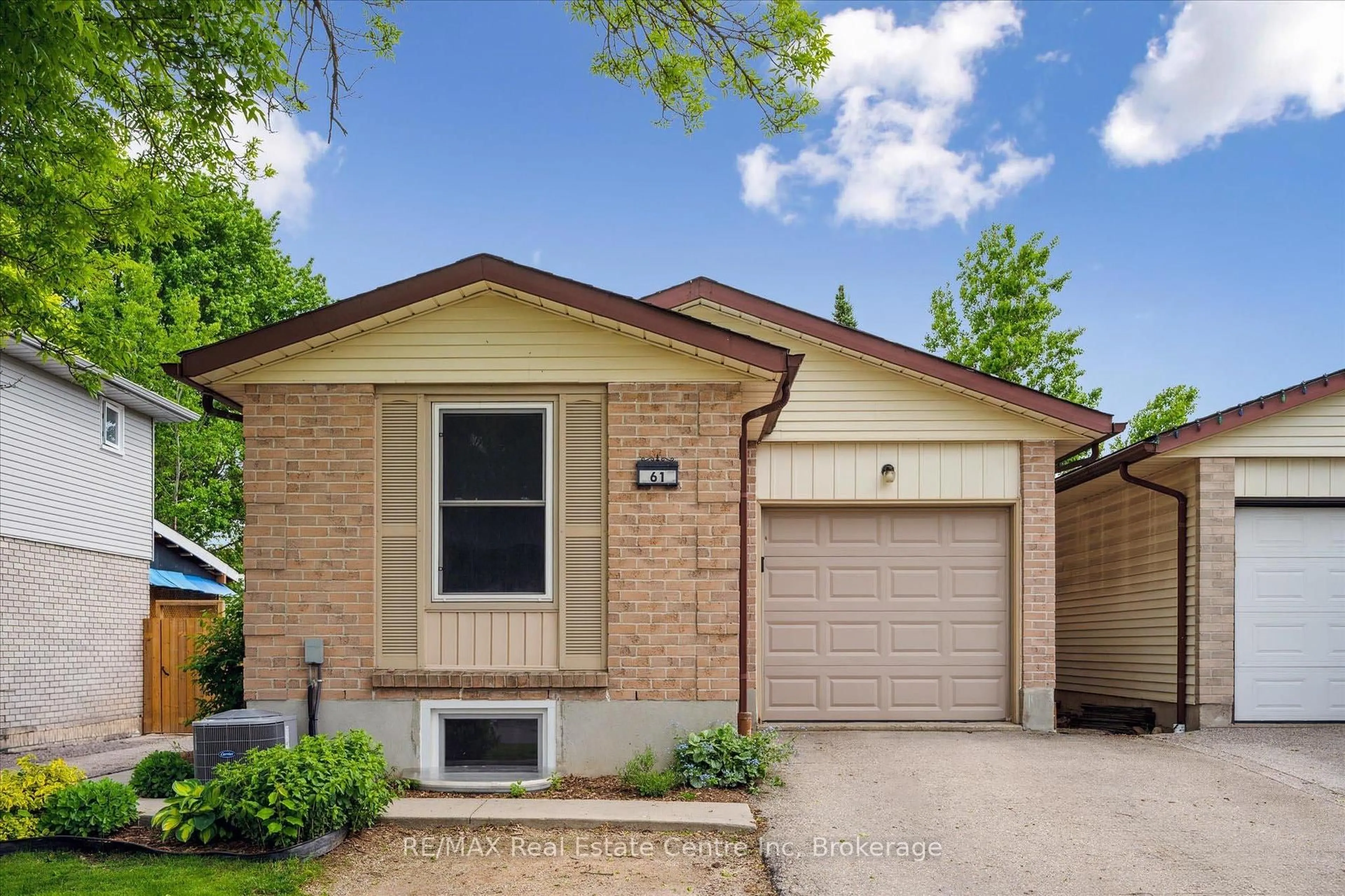 Home with brick exterior material, street for 61 LEACOCK Ave, Guelph Ontario N1E 6P9