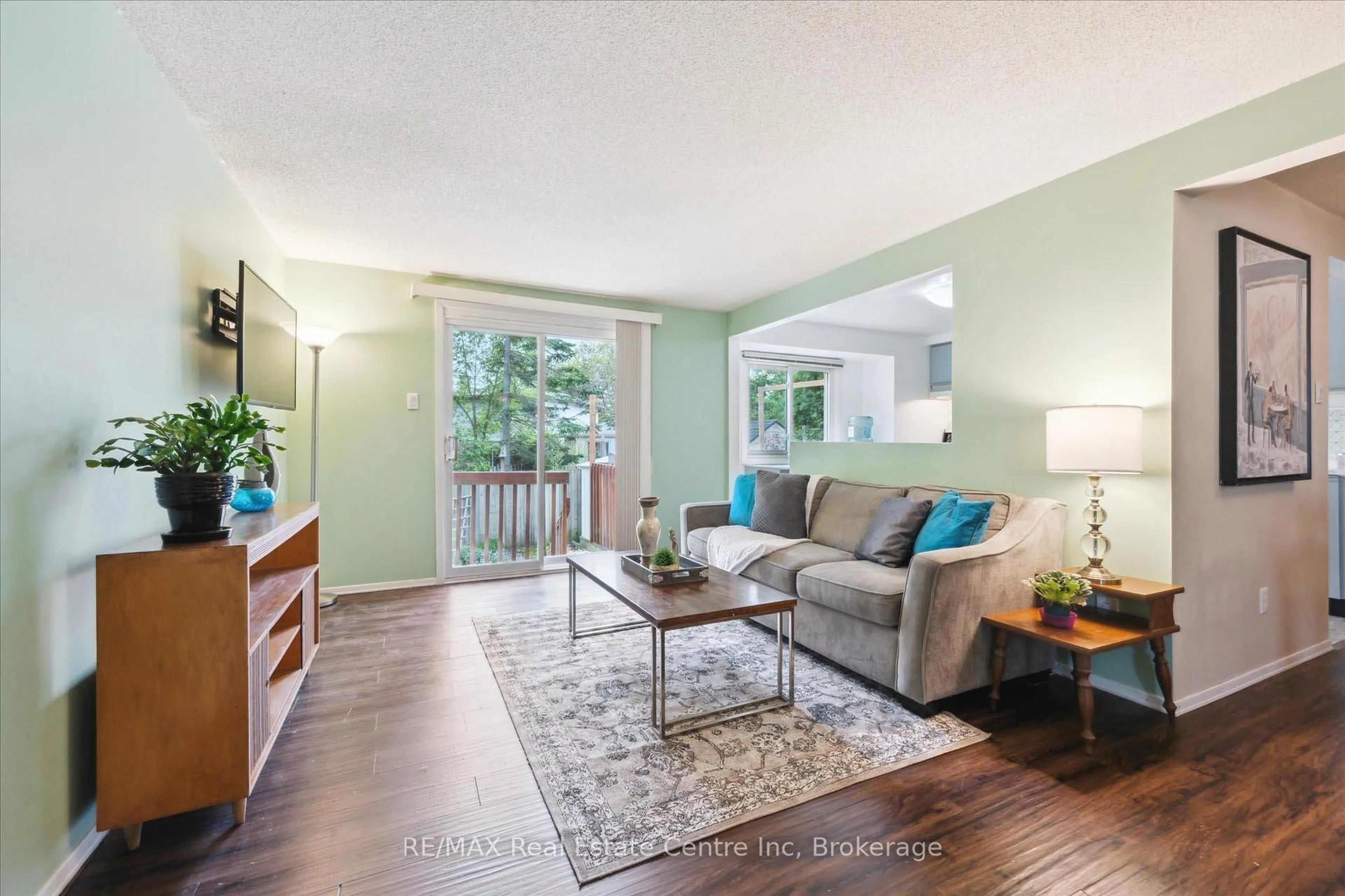 Living room with furniture, wood/laminate floor for 61 LEACOCK Ave, Guelph Ontario N1E 6P9