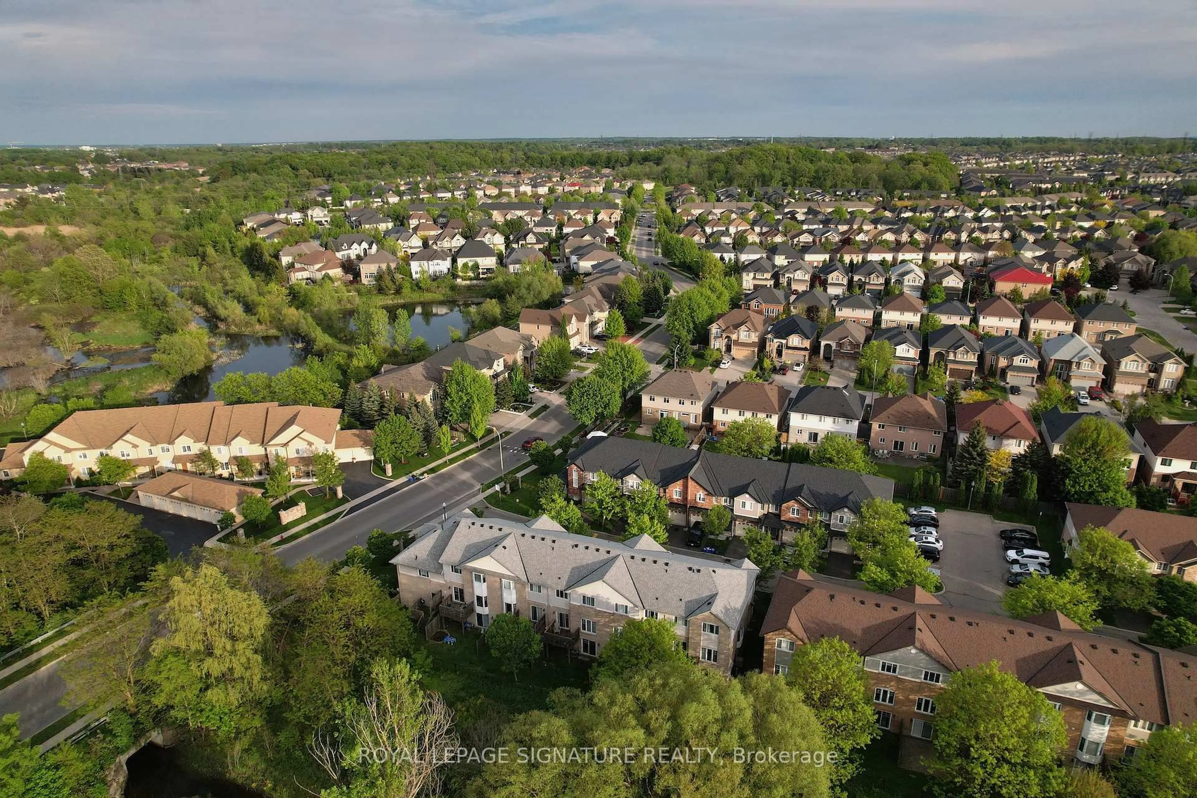 A pic from outside/outdoor area/front of a property/back of a property/a pic from drone, street for 60 Cloverleaf Dr #48, Hamilton Ontario L9K 1S8