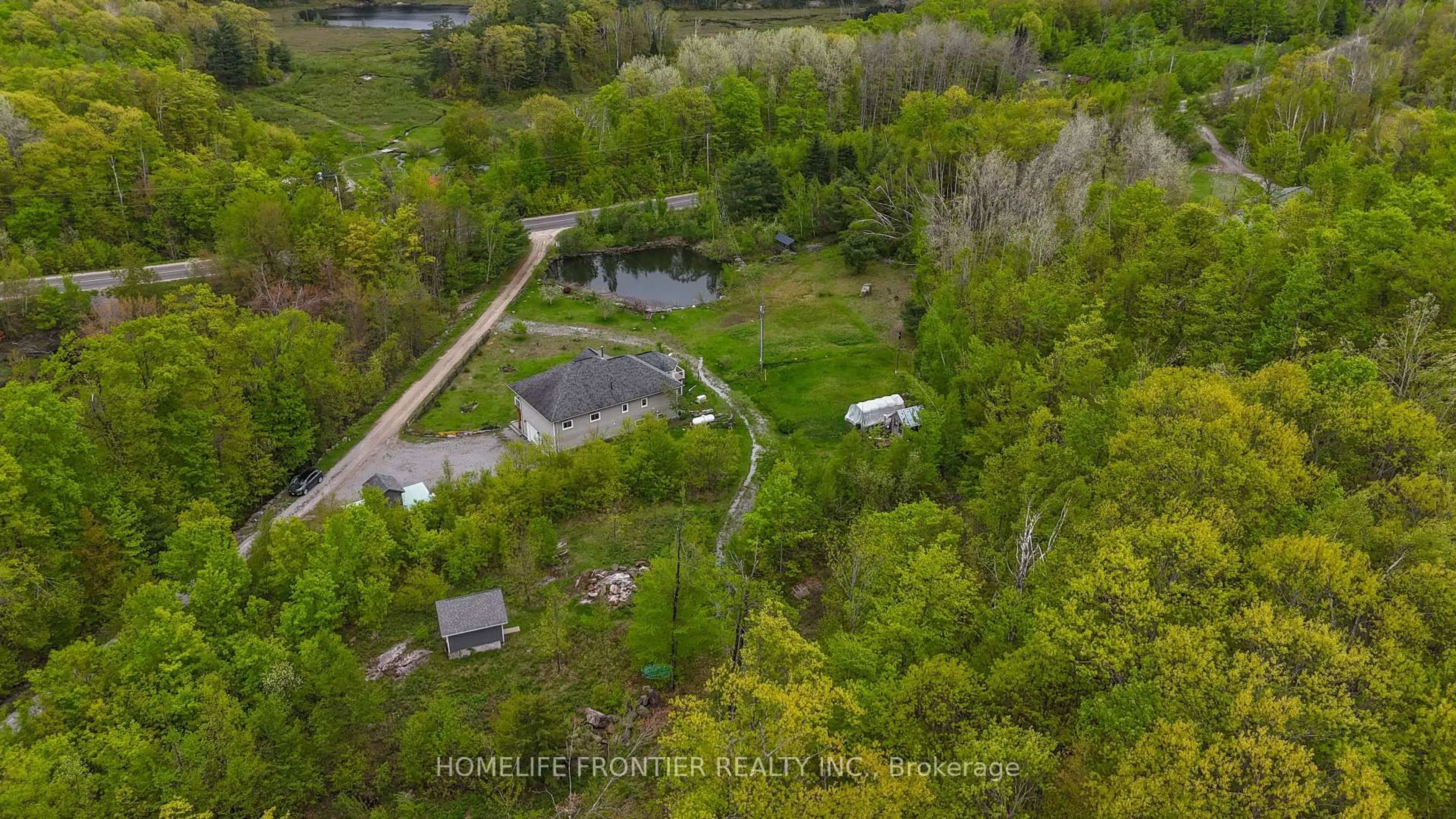 A pic from outside/outdoor area/front of a property/back of a property/a pic from drone, forest/trees view for 1019 Silk Lane, Minden Hills Ontario K0M 2K0