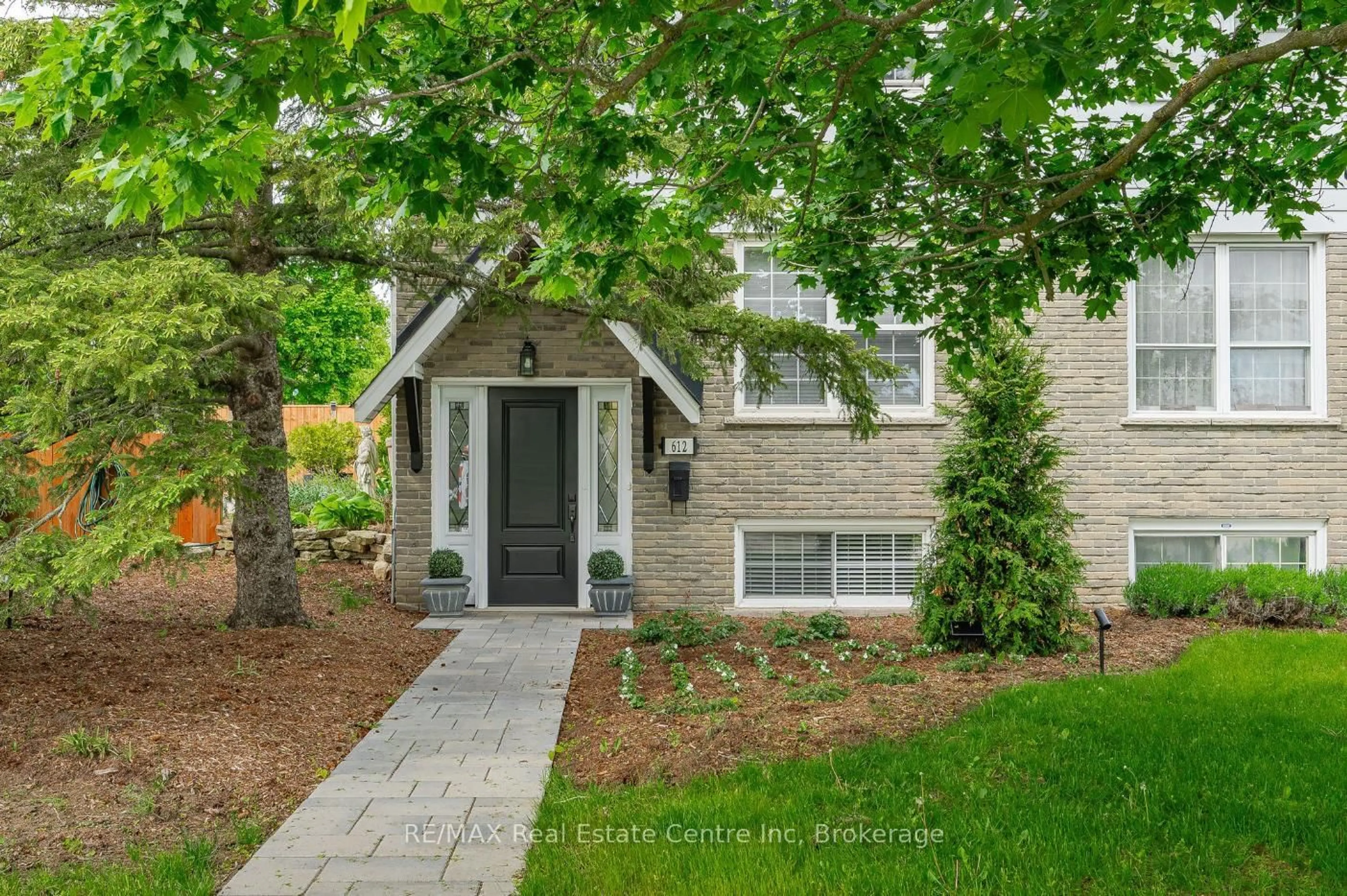 Home with brick exterior material, street for 612 COLLEGE Ave, Guelph Ontario N1G 1T8