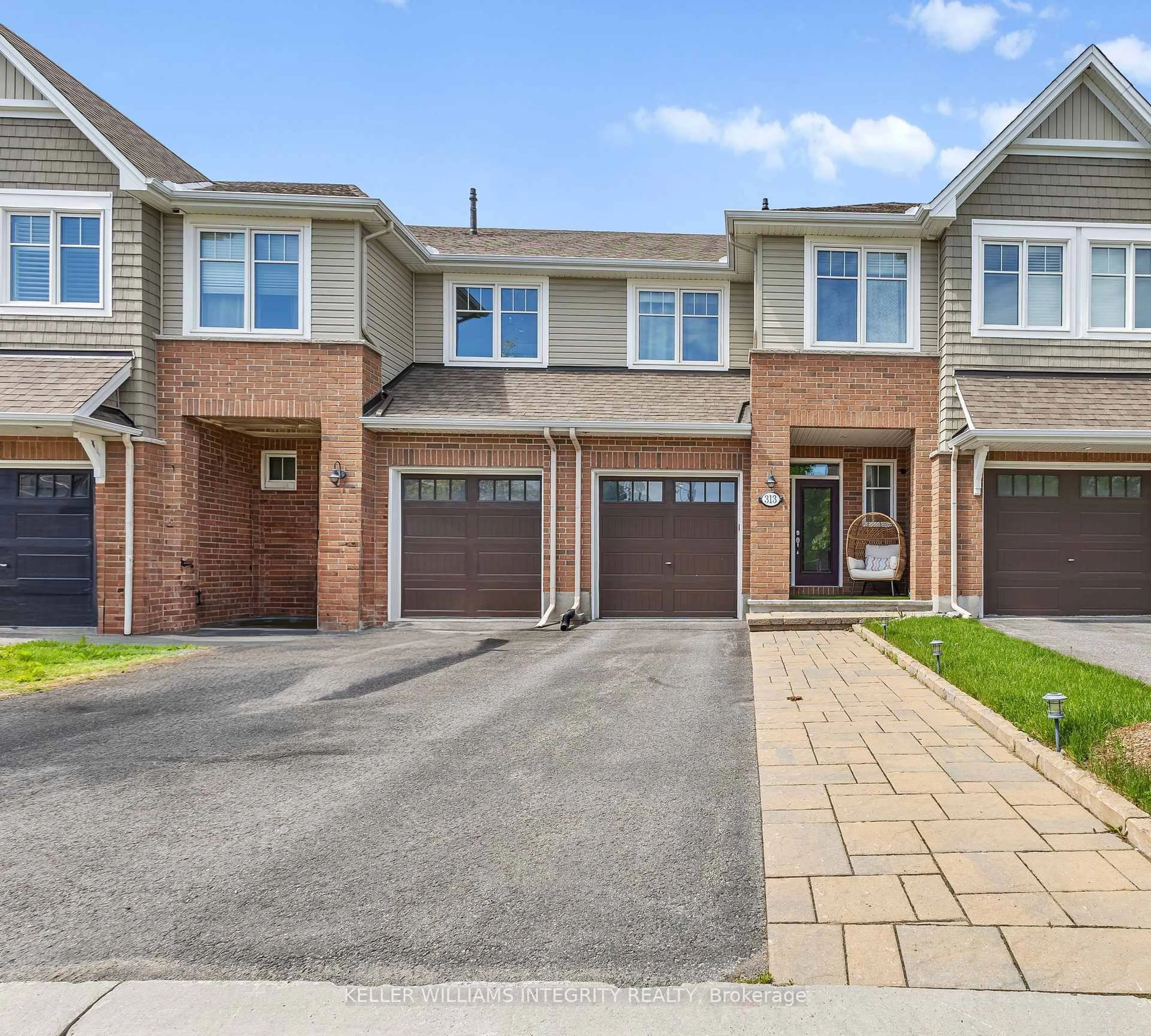 Home with brick exterior material, street for 313 Warmstone Dr, Stittsville Ontario K2S 0N9