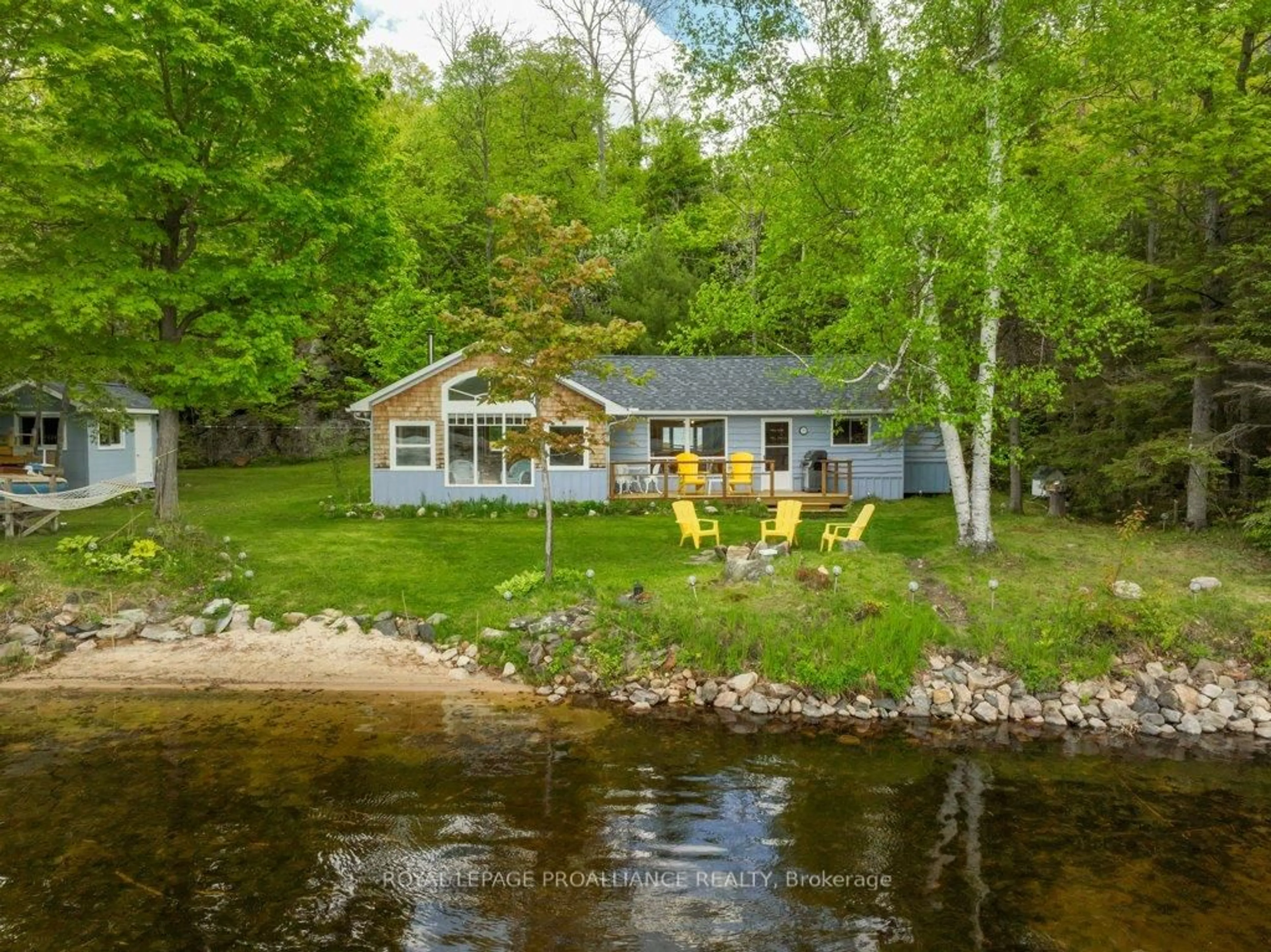 A pic from outside/outdoor area/front of a property/back of a property/a pic from drone, water/lake/river/ocean view for 1937A East Bay Rd, Plevna Ontario K0H 2M0