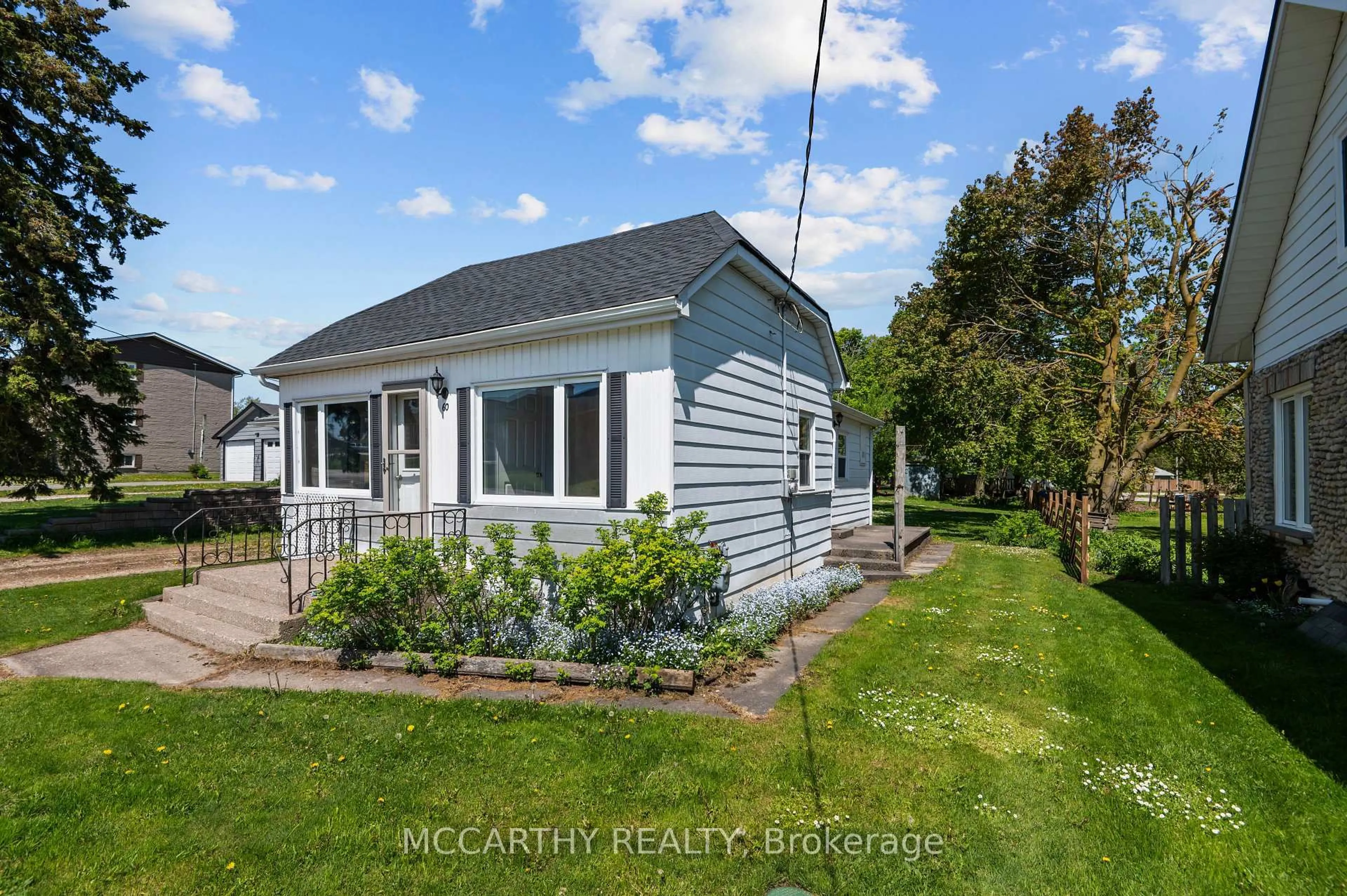 A pic from outside/outdoor area/front of a property/back of a property/a pic from drone, water/lake/river/ocean view for 60 Owen Sound St, Southgate Ontario N0C 1B0