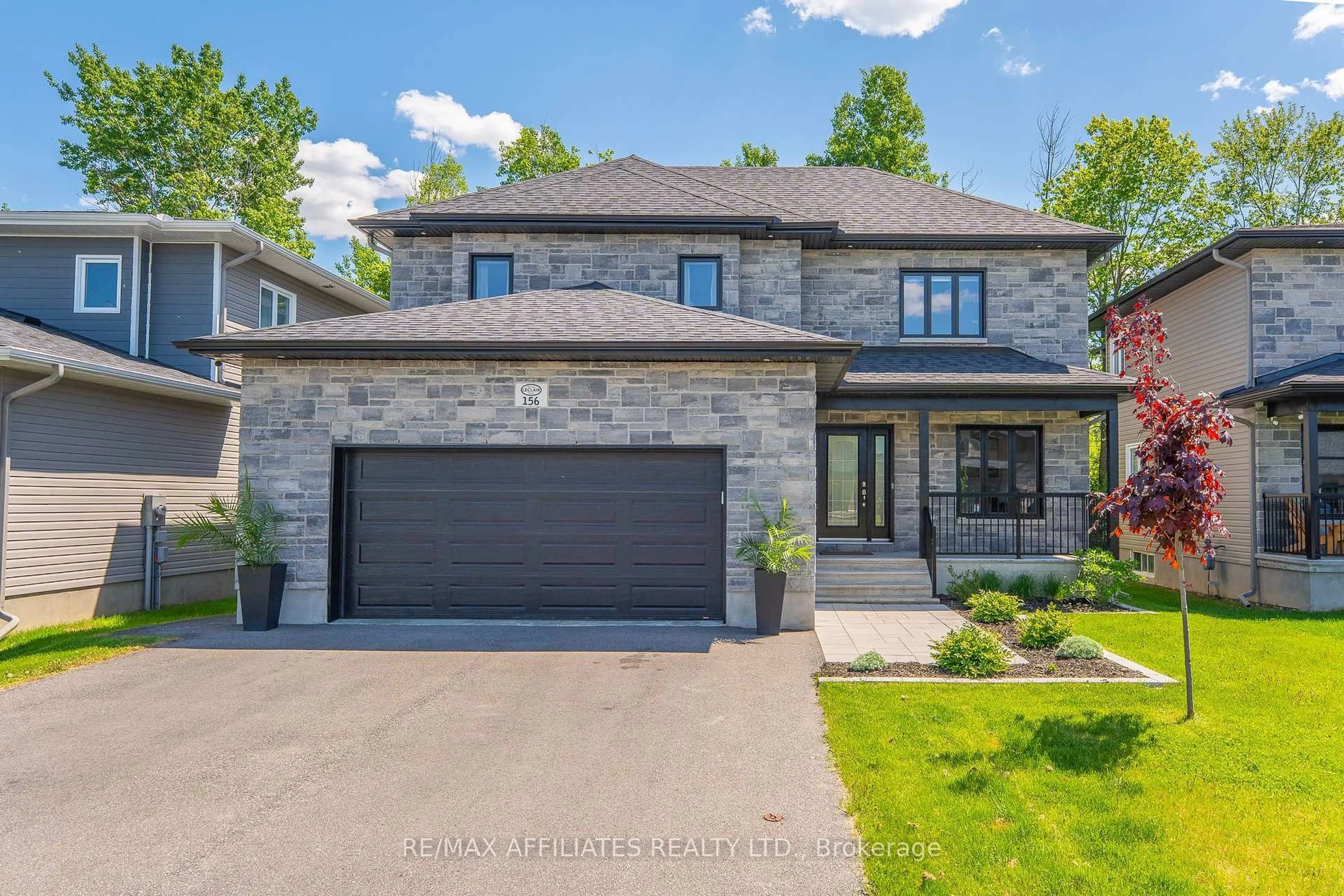 Home with brick exterior material, street for 156 Hybrid St, Russell Ontario K0A 1W0