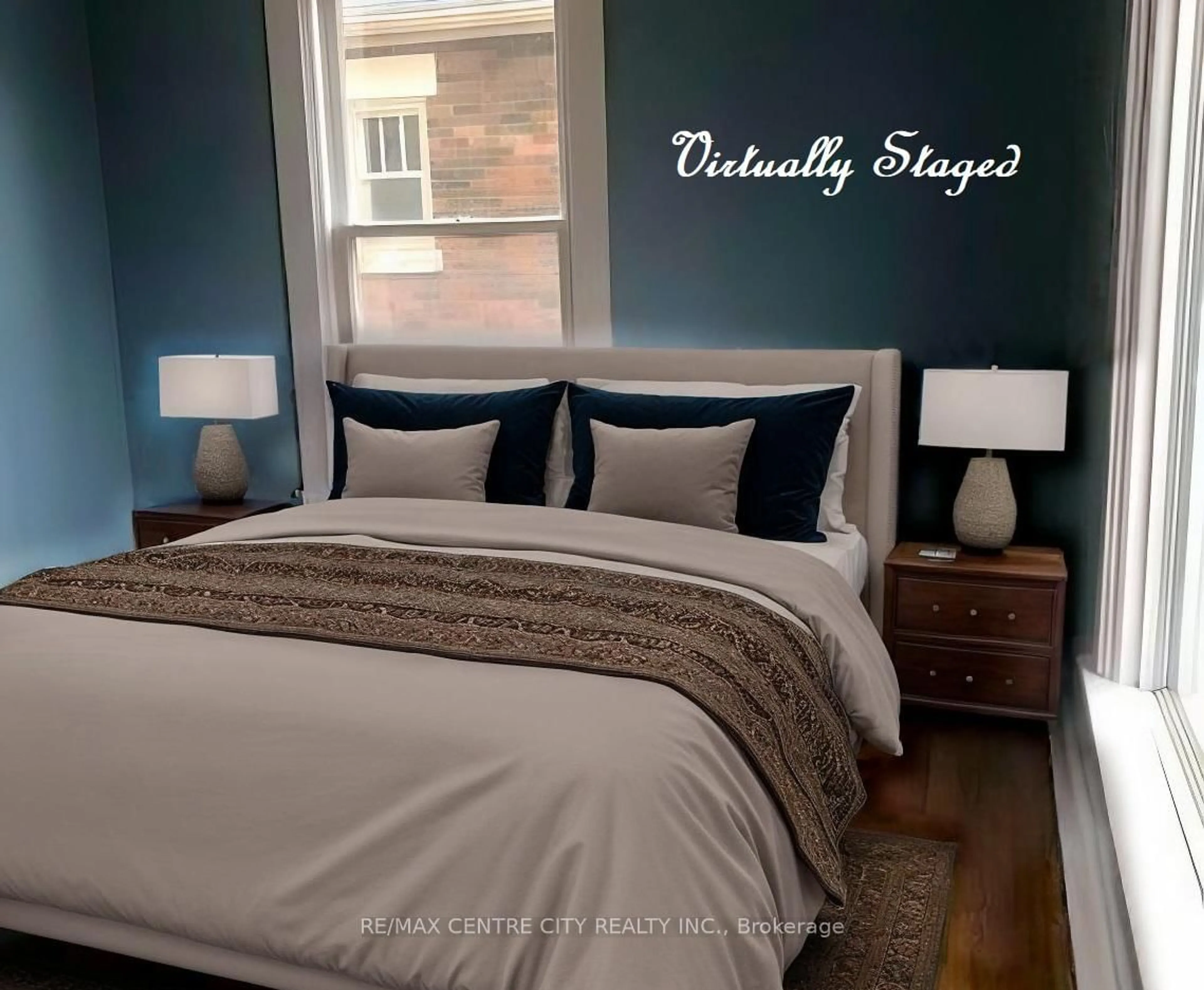 Bedroom with bed, wood/laminate floor for 171 Sydenham St, Aylmer Ontario N5H 1L6