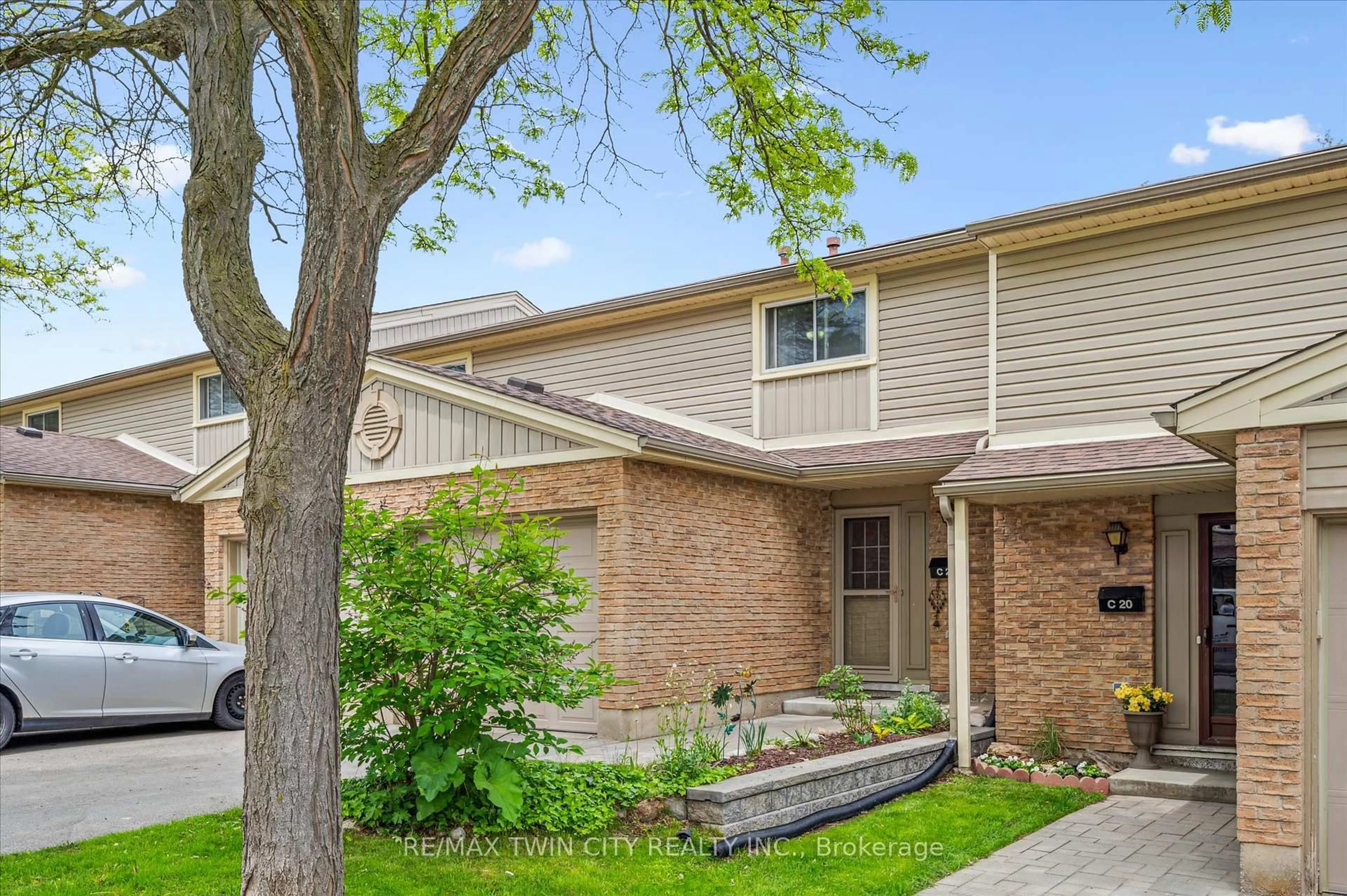 Home with brick exterior material, street for 223 Pioneer Dr, Kitchener Ontario N2P 1L9