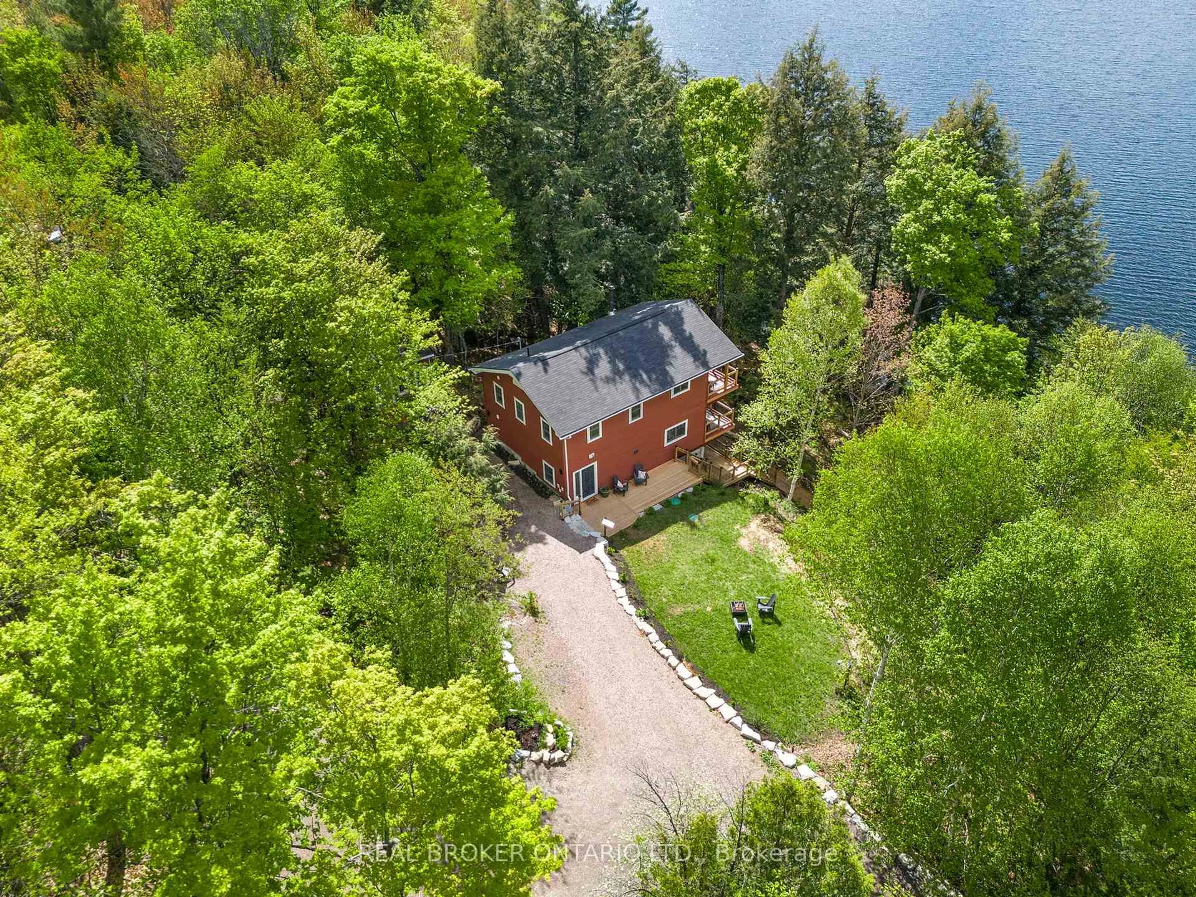 A pic from outside/outdoor area/front of a property/back of a property/a pic from drone, water/lake/river/ocean view for 25 ASH Lane, Magnetawan Ontario P0A 1P0