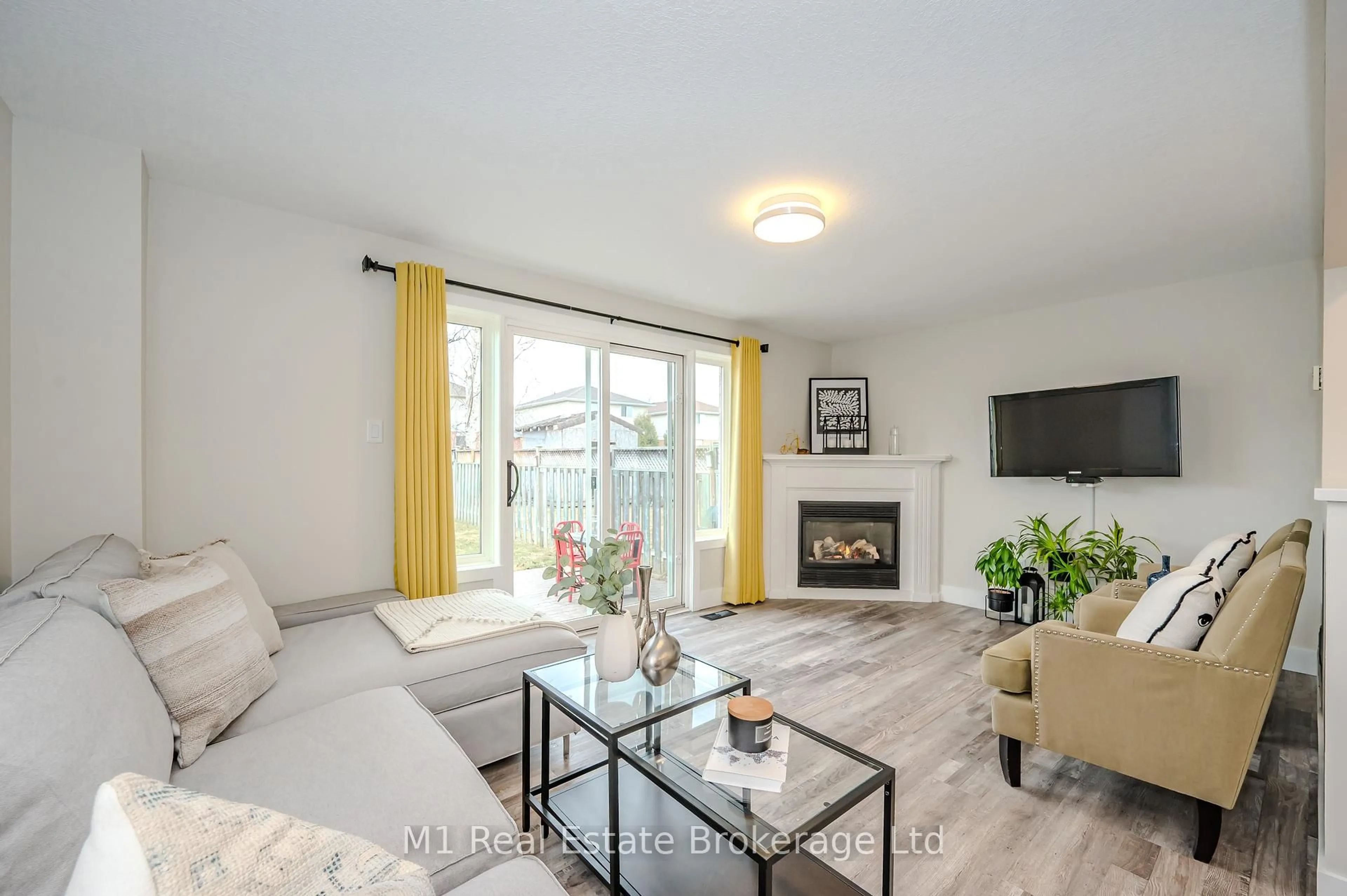 Living room with furniture, wood/laminate floor for 155 Stephanie Dr, Guelph Ontario N1K 1X7