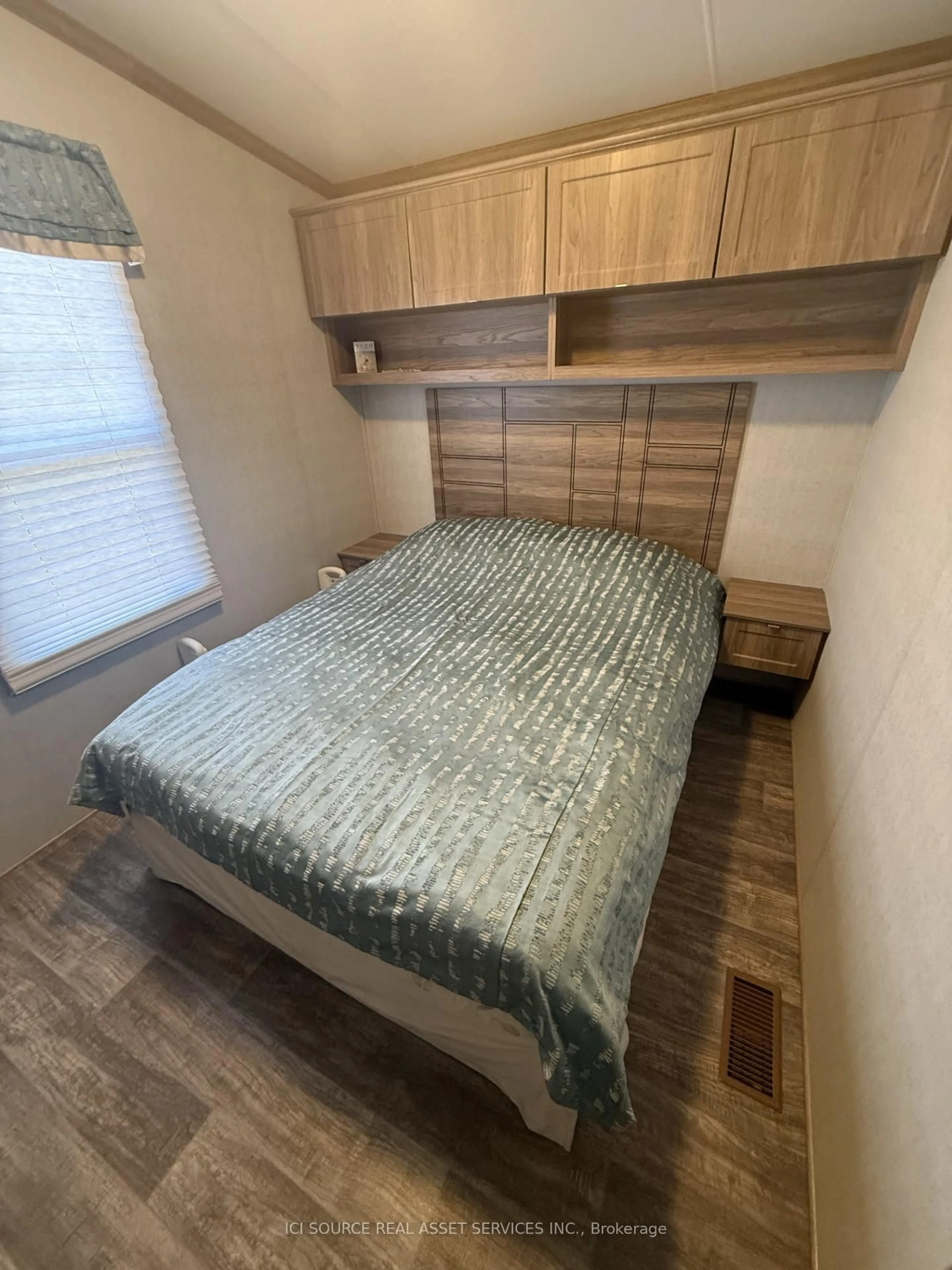Bedroom with bed, wood/laminate floor for 1235 Villiers Line #CHL034, Otonabee-South Monaghan Ontario K0L 2G0