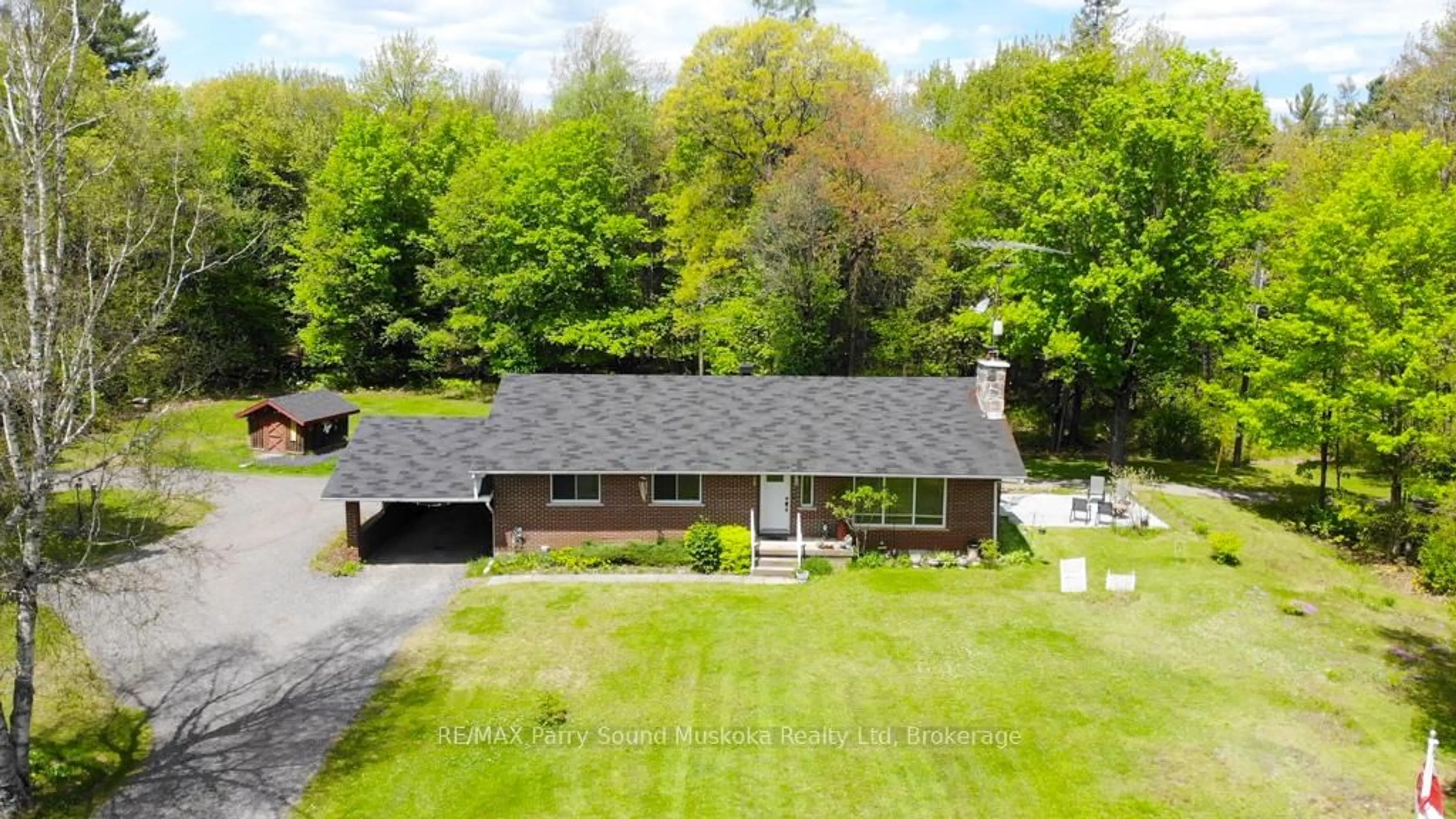 A pic from outside/outdoor area/front of a property/back of a property/a pic from drone, street for 4838 124 Highway, Magnetawan Ontario P0A 1P0