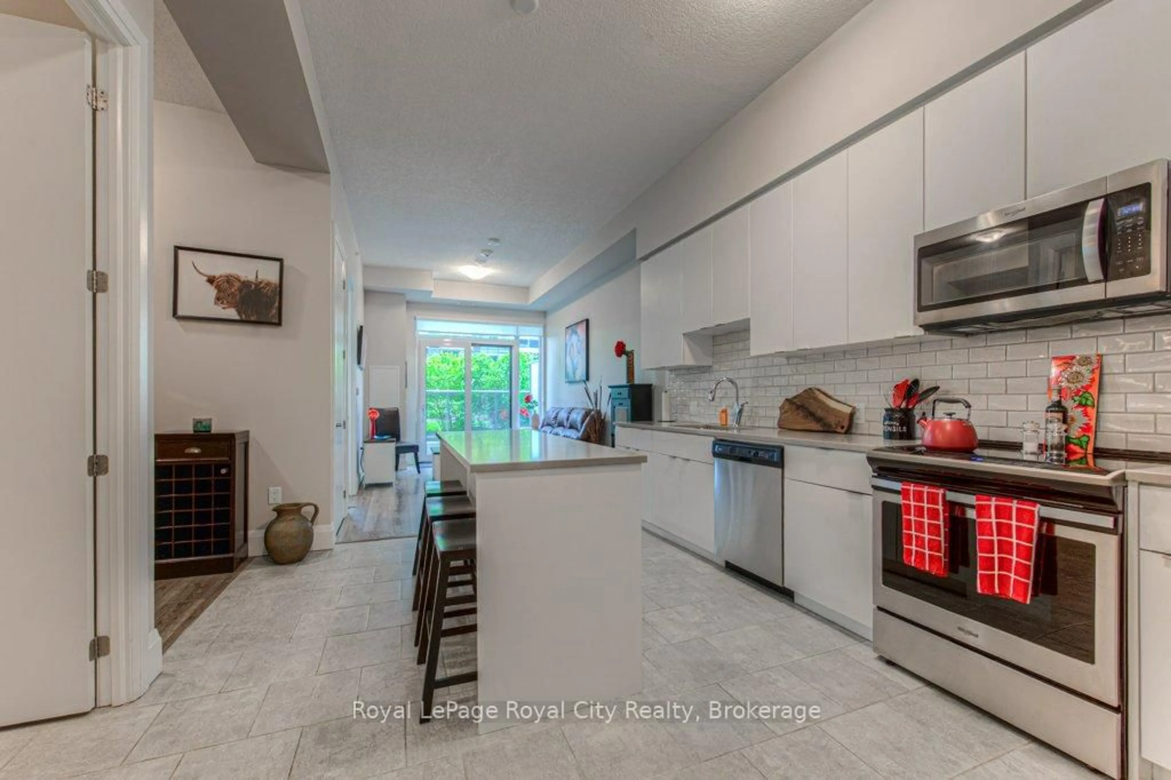 Open concept kitchen, ceramic/tile floor for 73 Arthur St #210, Guelph Ontario N1E 0S6