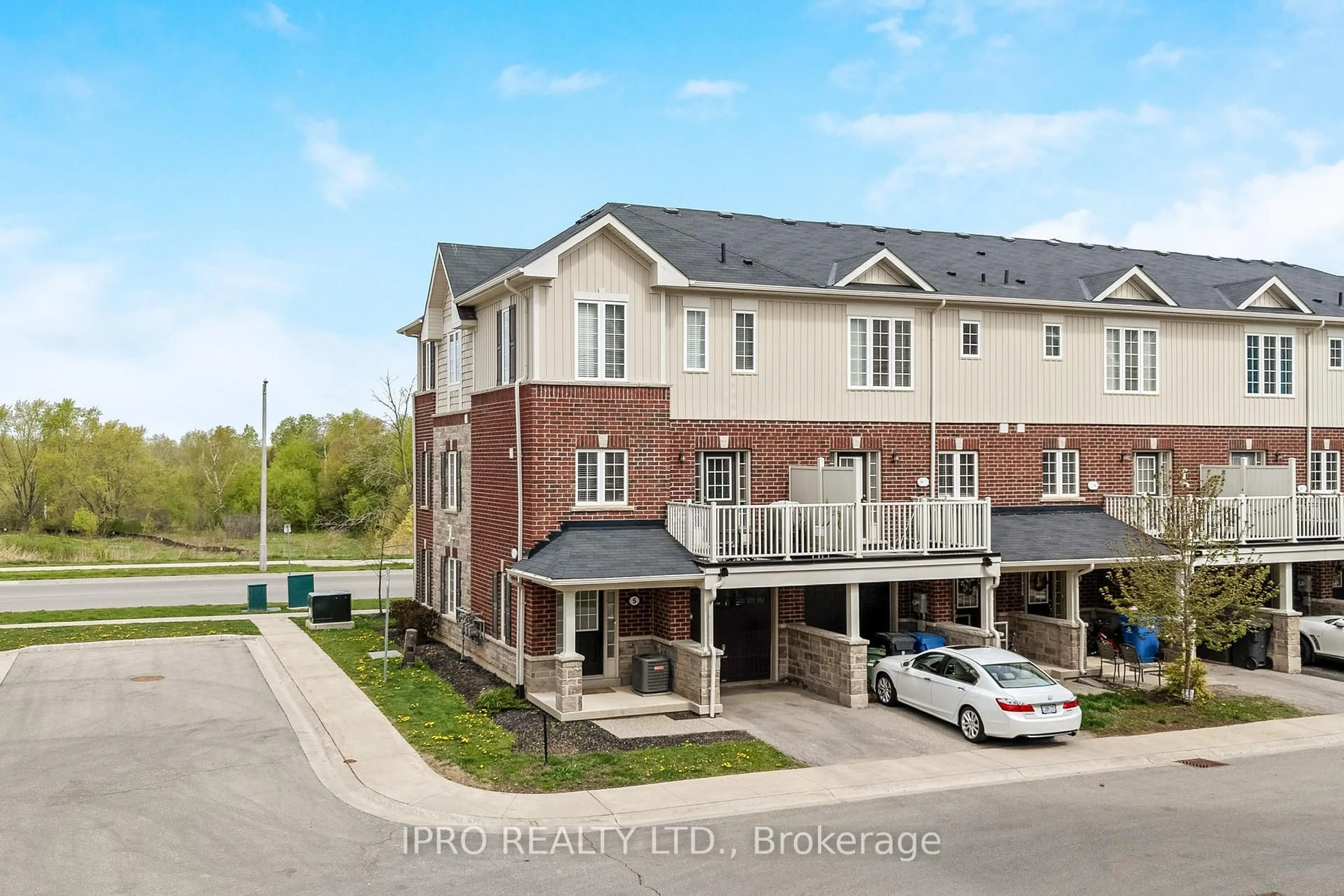 A pic from outside/outdoor area/front of a property/back of a property/a pic from drone, street for 88 Decorso Dr #5, Guelph Ontario N1L 0A1