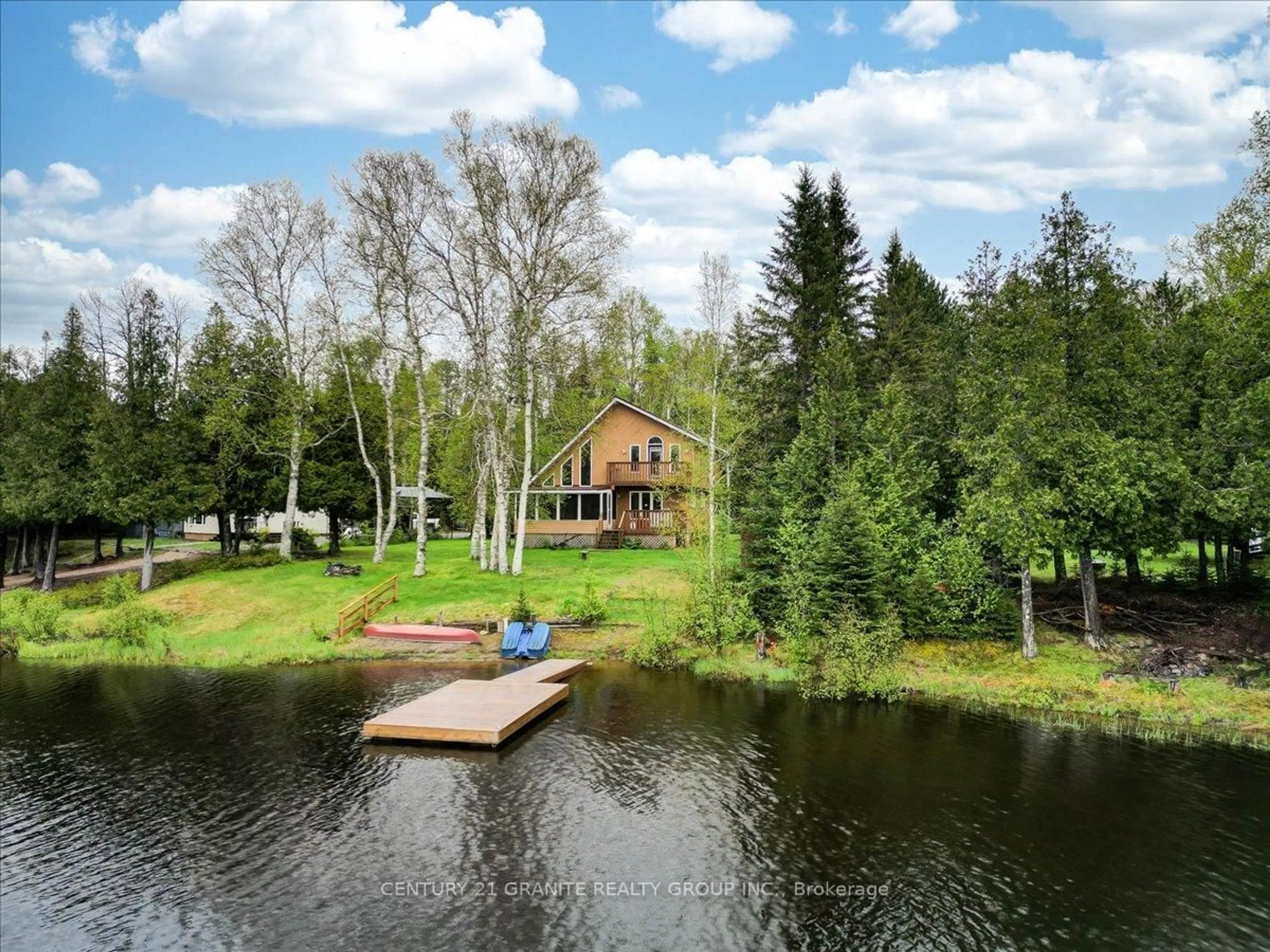 A pic from outside/outdoor area/front of a property/back of a property/a pic from drone, water/lake/river/ocean view for 81 Macrae Lane, Maynooth Ontario K0L 2S0