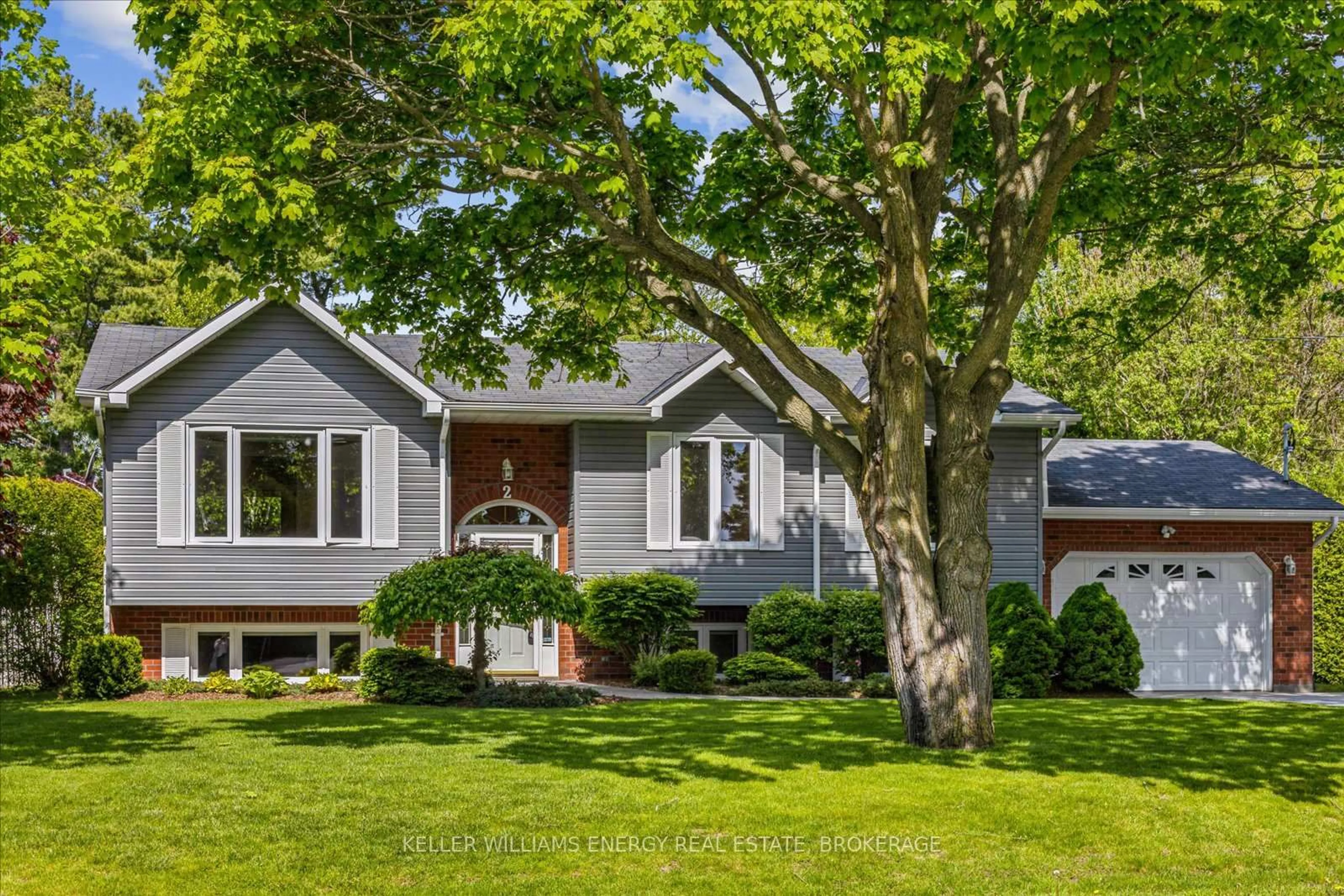 Home with vinyl exterior material, street for 2 Moore Dr, Port Hope Ontario L1A 2E6