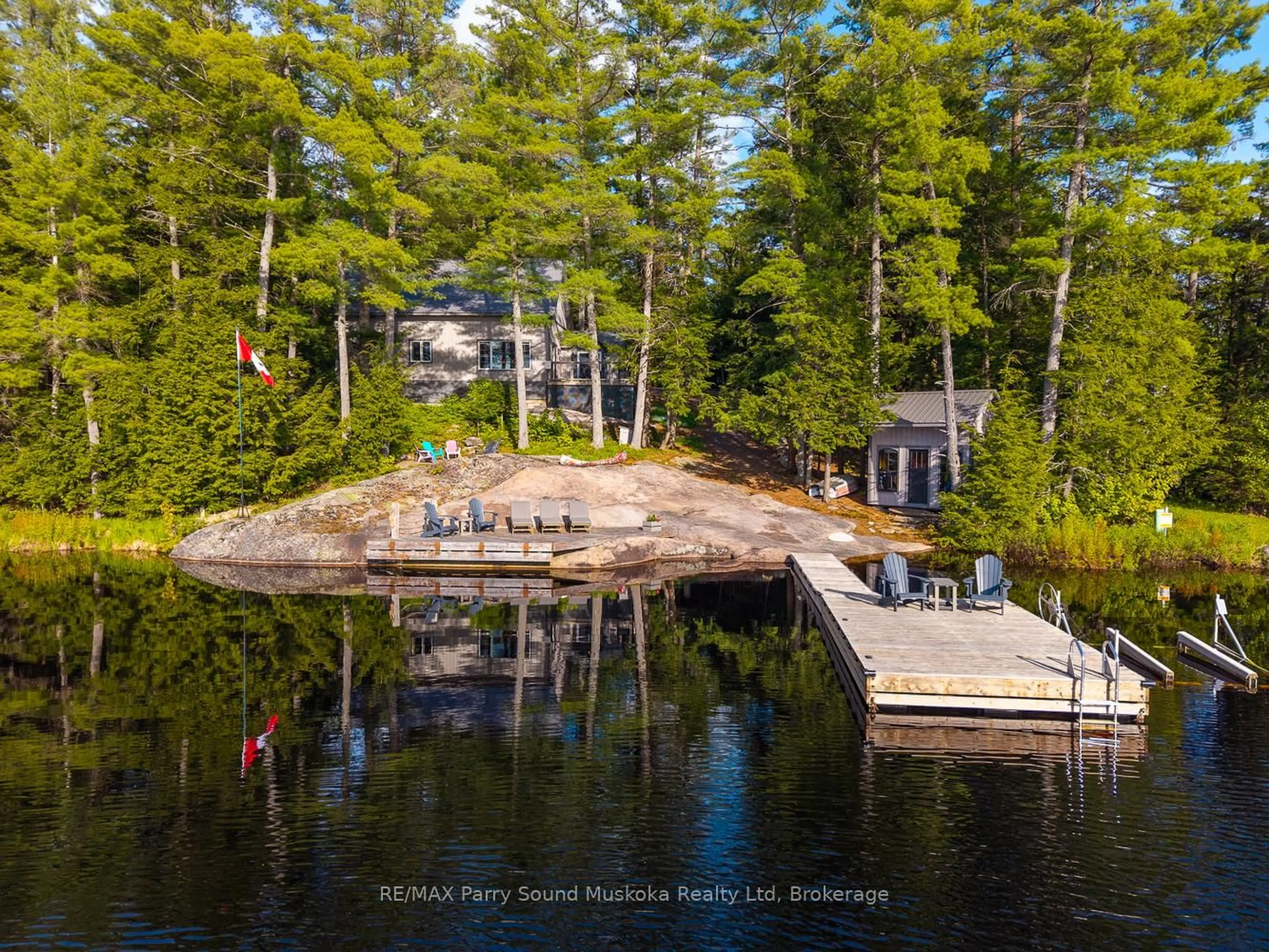 A pic from outside/outdoor area/front of a property/back of a property/a pic from drone, water/lake/river/ocean view for 61B Hamer Bay Rd, Seguin Ontario P0C 1H0