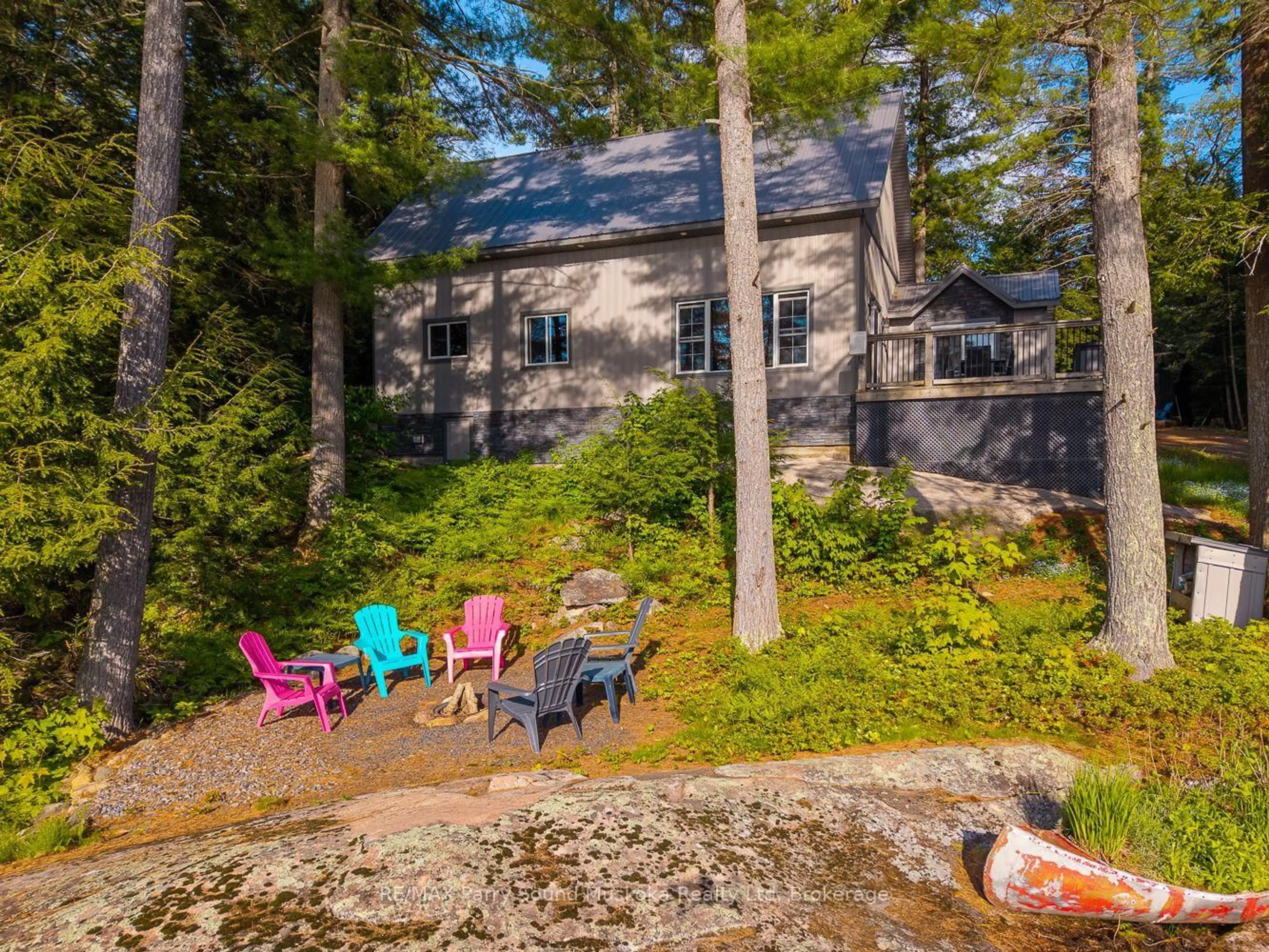 A pic from outside/outdoor area/front of a property/back of a property/a pic from drone, water/lake/river/ocean view for 61B Hamer Bay Rd, Seguin Ontario P0C 1H0