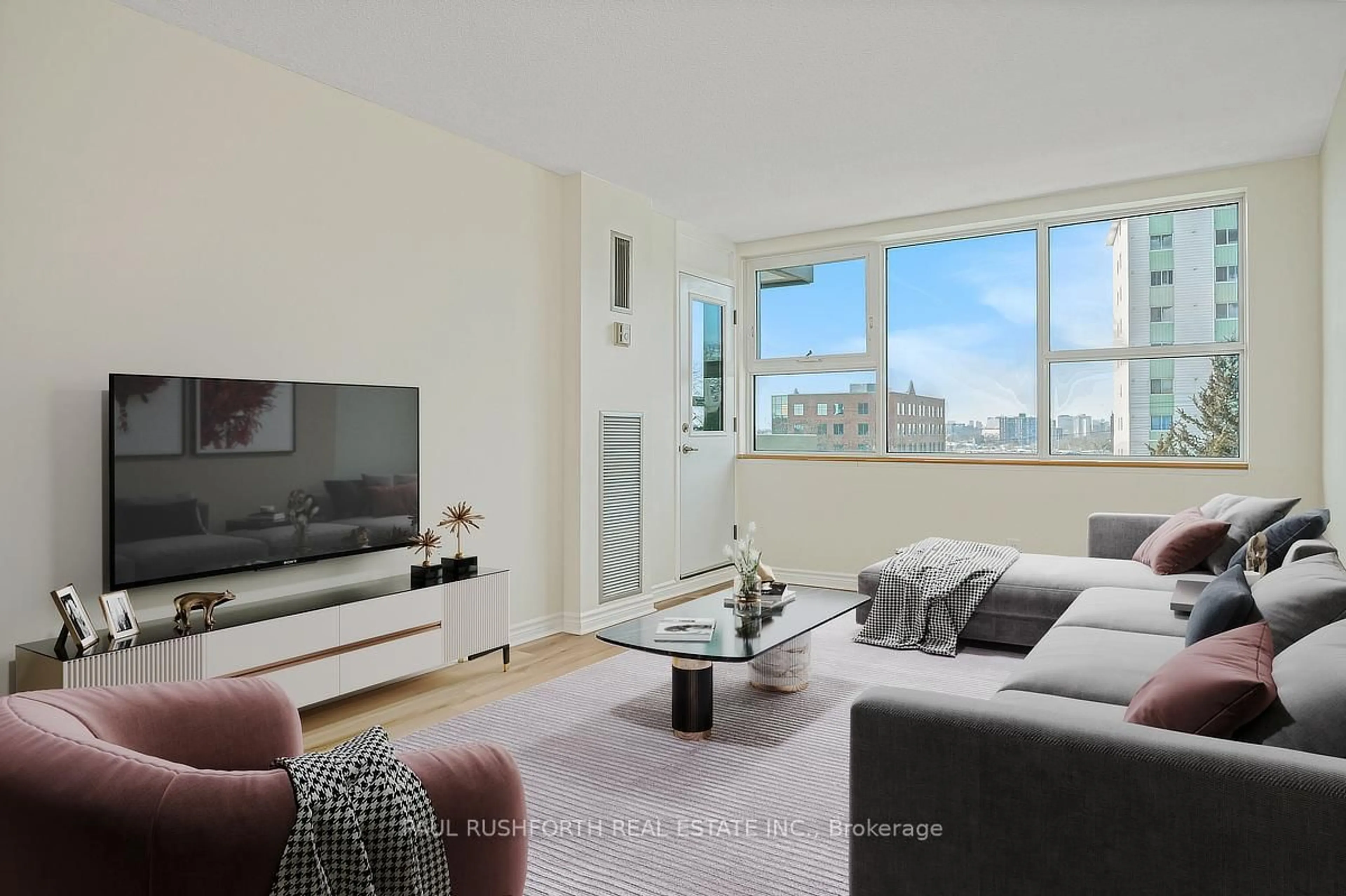 Living room with furniture, unknown for 555 Brittany Dr #302, Ottawa Ontario K1K 4C5
