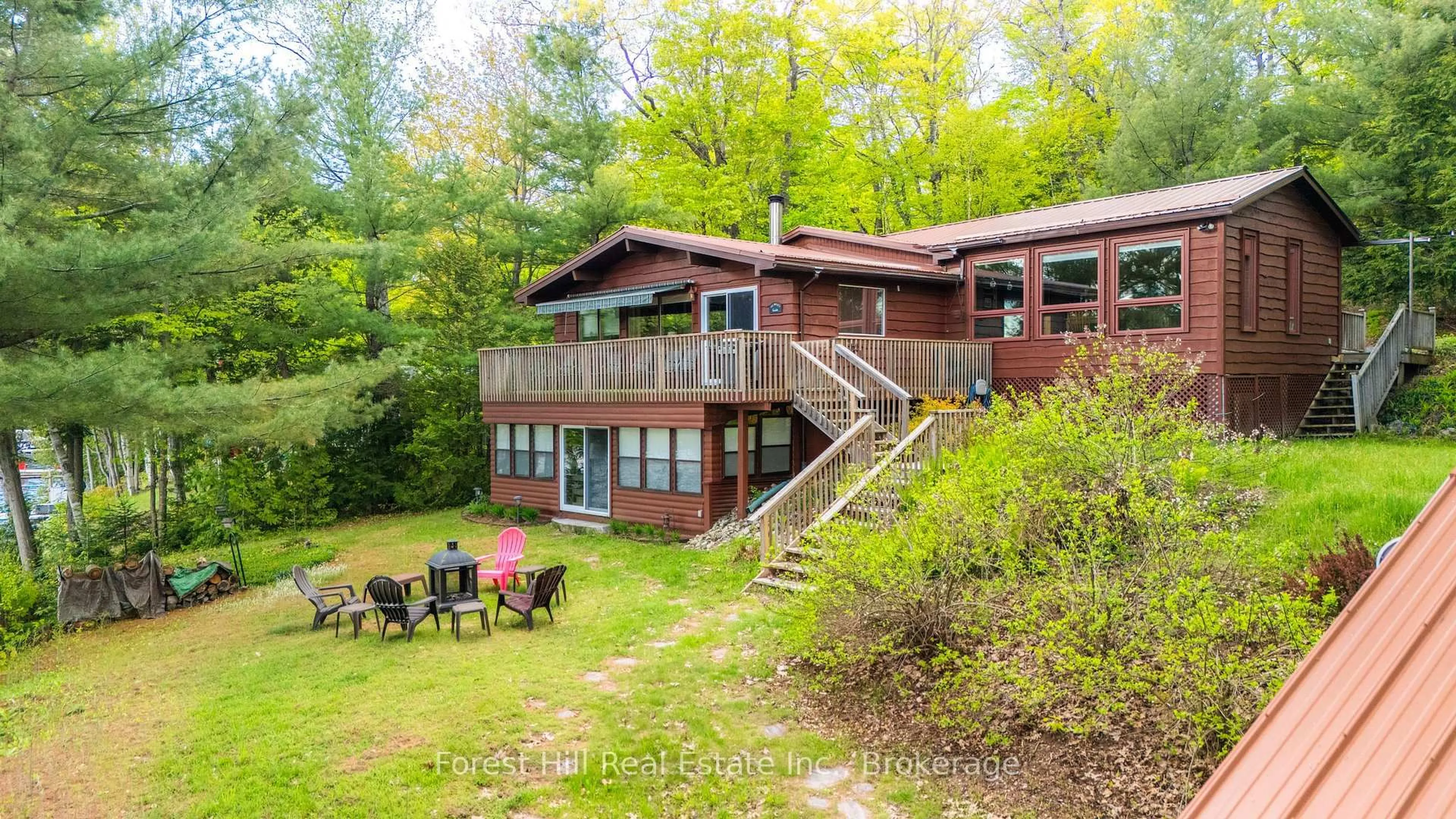 A pic from outside/outdoor area/front of a property/back of a property/a pic from drone, water/lake/river/ocean view for 445 Lorimer Lake Rd, McDougall Ontario P2A 2W7