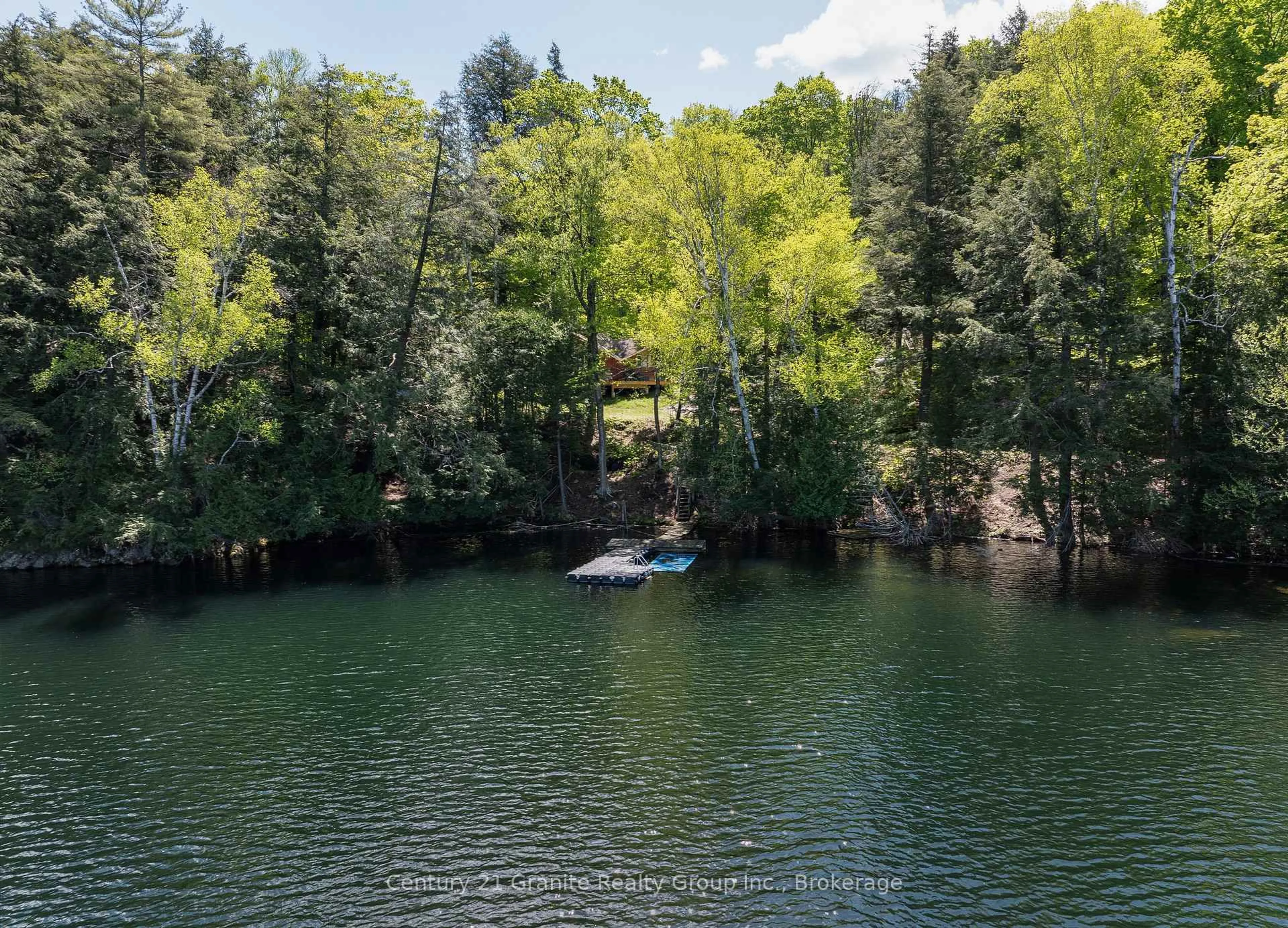 A pic from outside/outdoor area/front of a property/back of a property/a pic from drone, water/lake/river/ocean view for 1145 Mink Rd, Dysart et al Ontario K0M 1S0