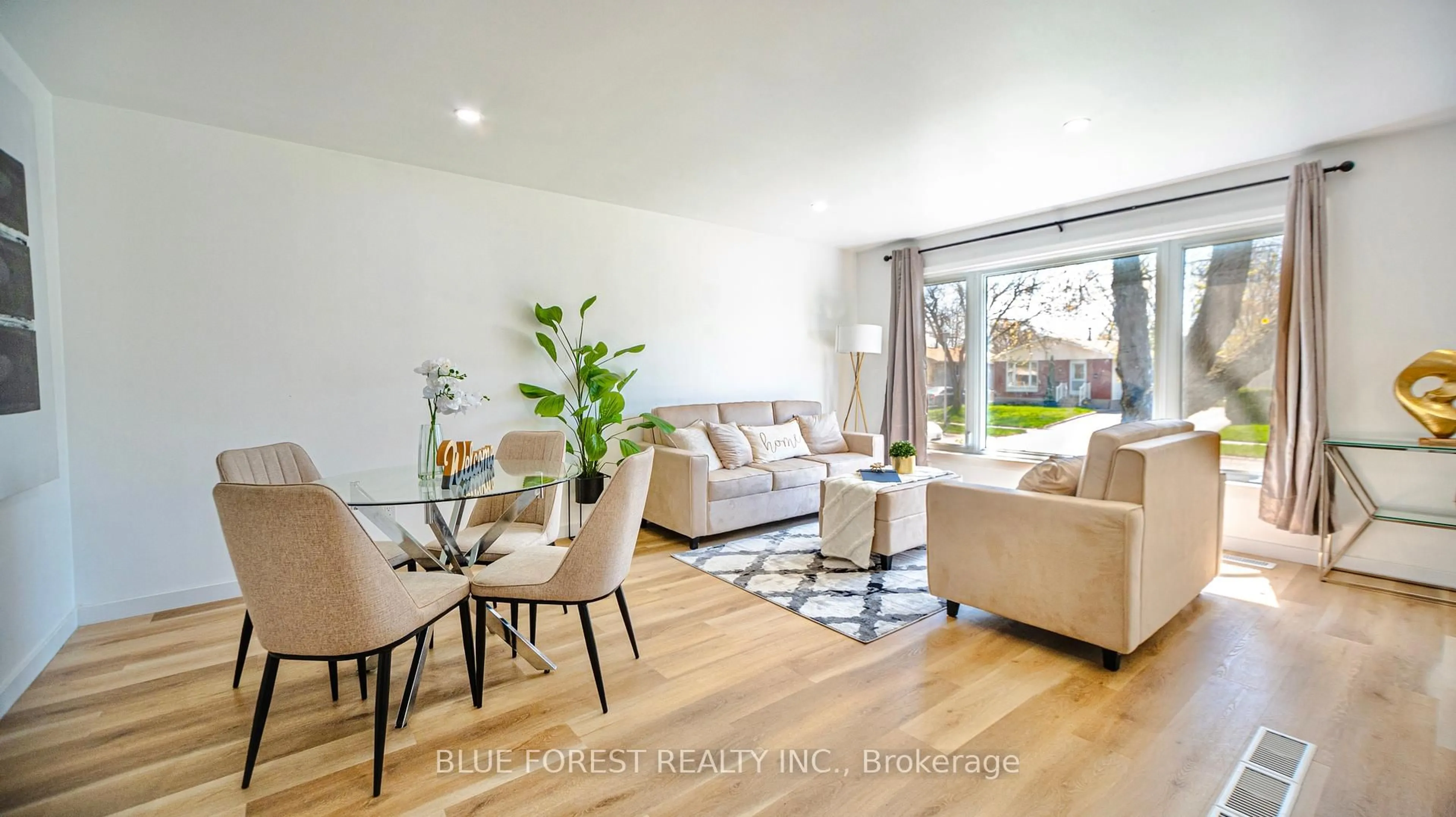Living room with furniture, wood/laminate floor for 47 Piers Cres, London South Ontario N6E 1Z1