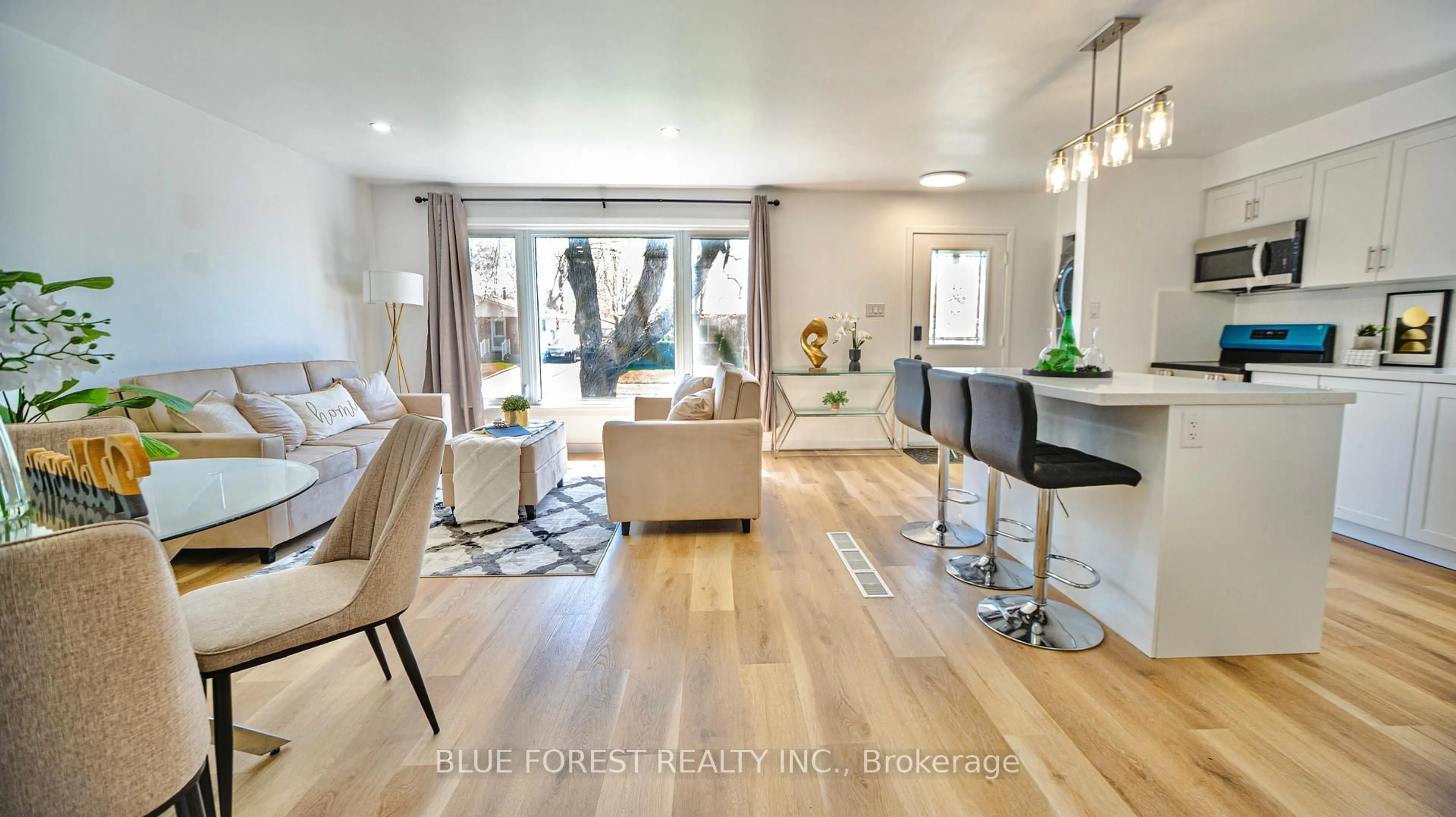 Living room with furniture, wood/laminate floor for 47 Piers Cres, London South Ontario N6E 1Z1