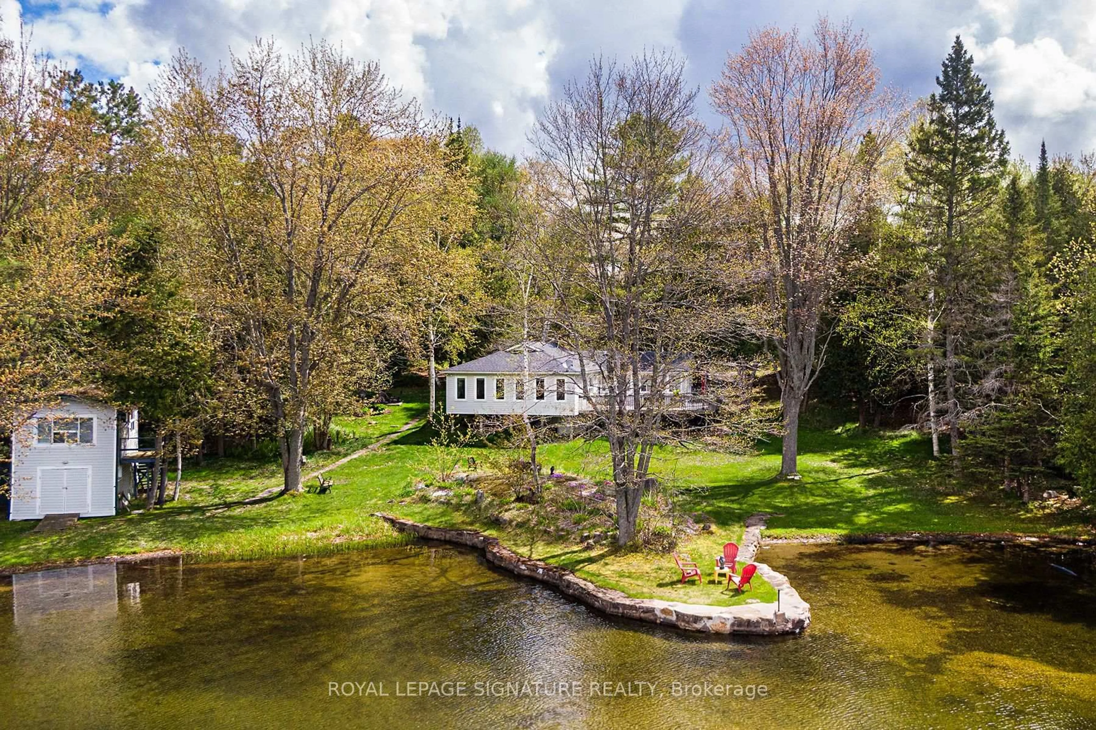 A pic from outside/outdoor area/front of a property/back of a property/a pic from drone, water/lake/river/ocean view for 1270 Wessell Rd, Minden Hills Ontario K0M 2L1