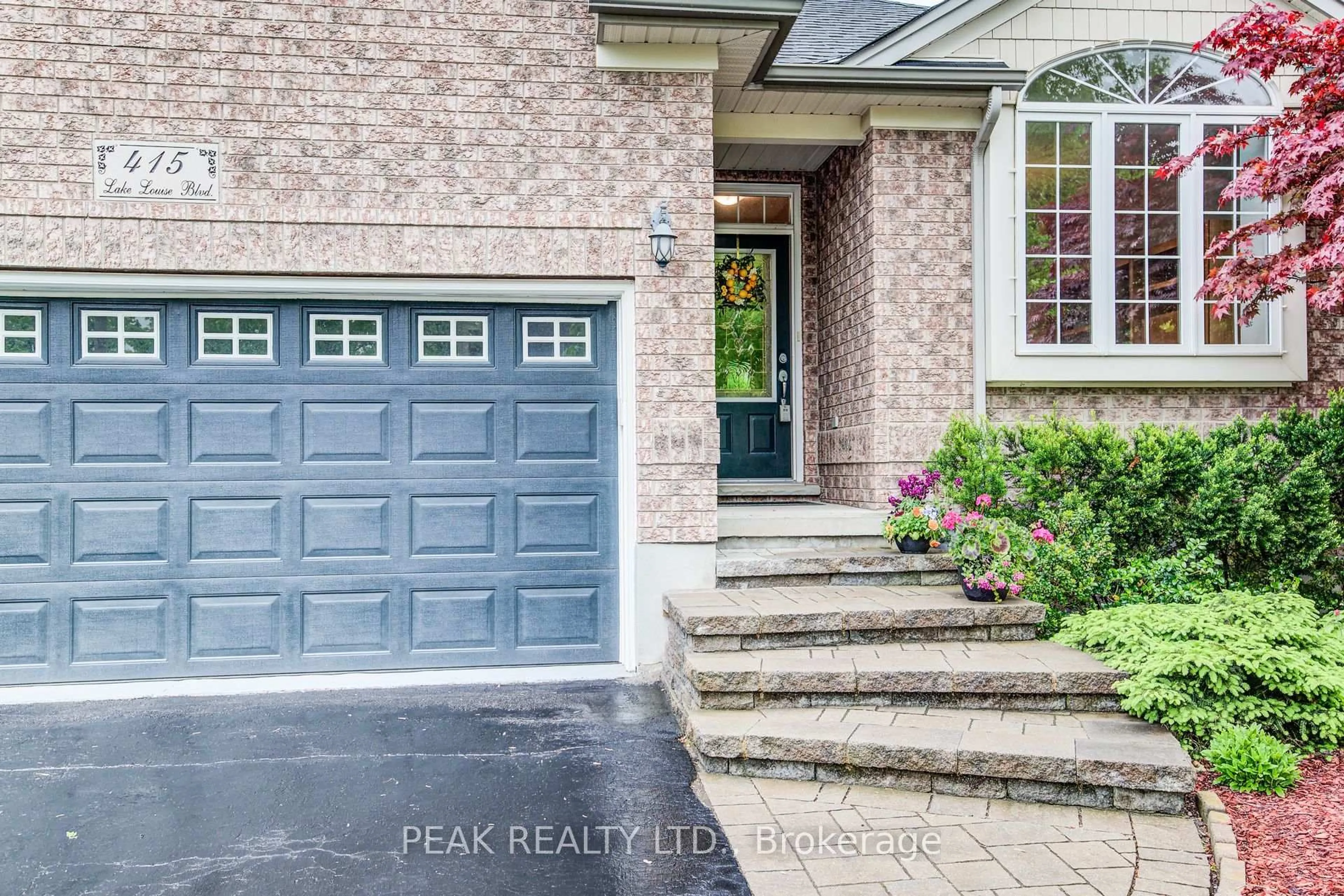 Home with brick exterior material, street for 415 Lake Louise Blvd, Waterloo Ontario N2V 2K4