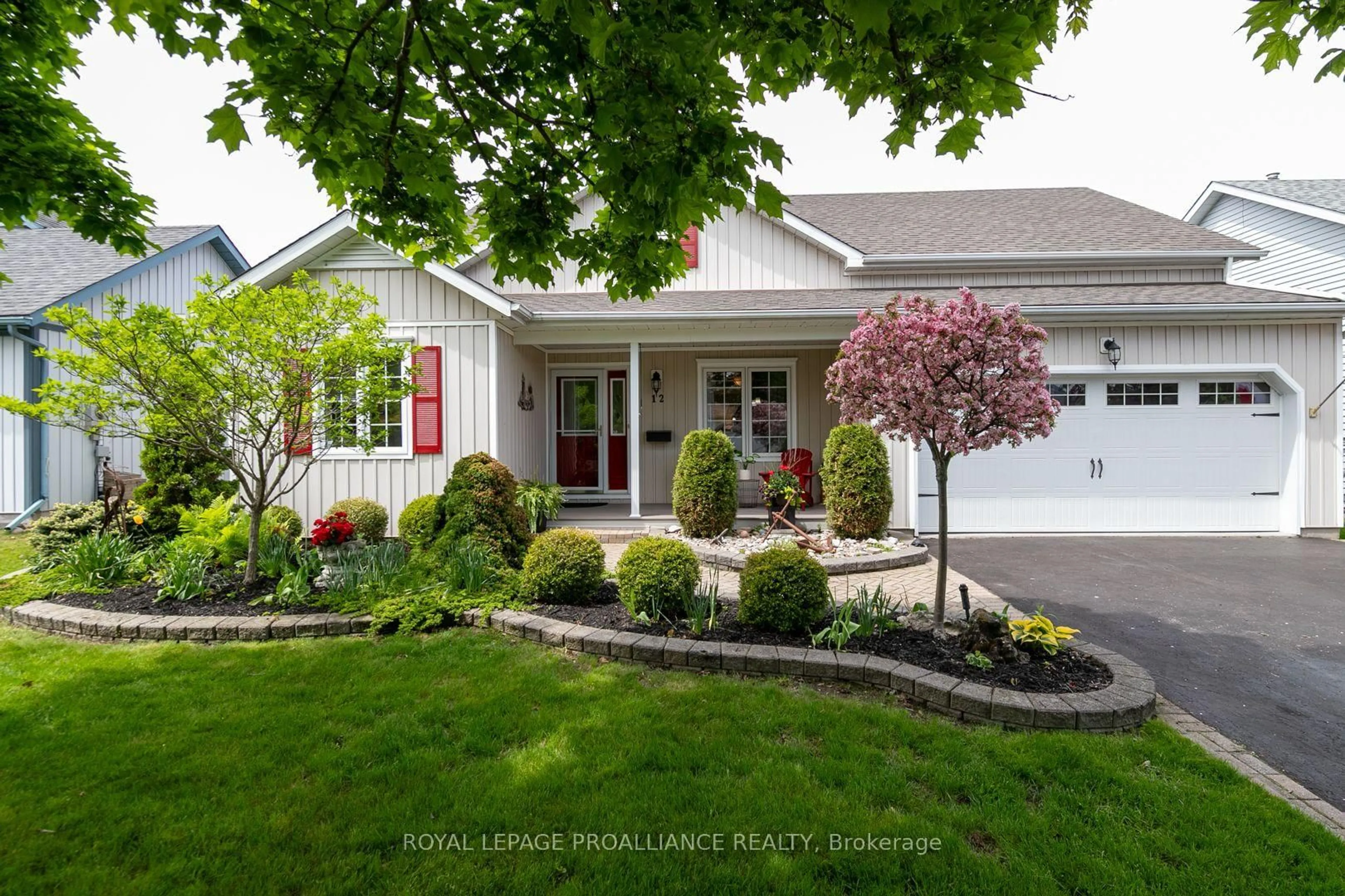 Home with vinyl exterior material, street for 12 Mills Rd, Brighton Ontario K0K 1H0