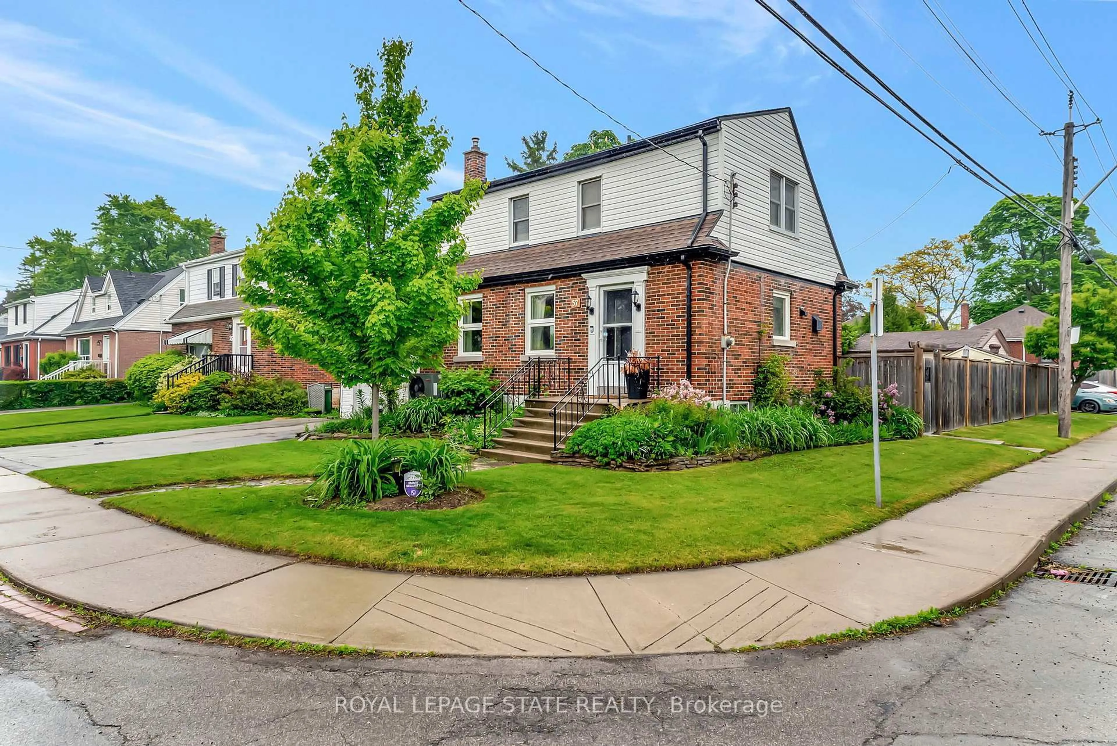 Home with brick exterior material, street for 57 West 4th St, Hamilton Ontario L9C 3M5