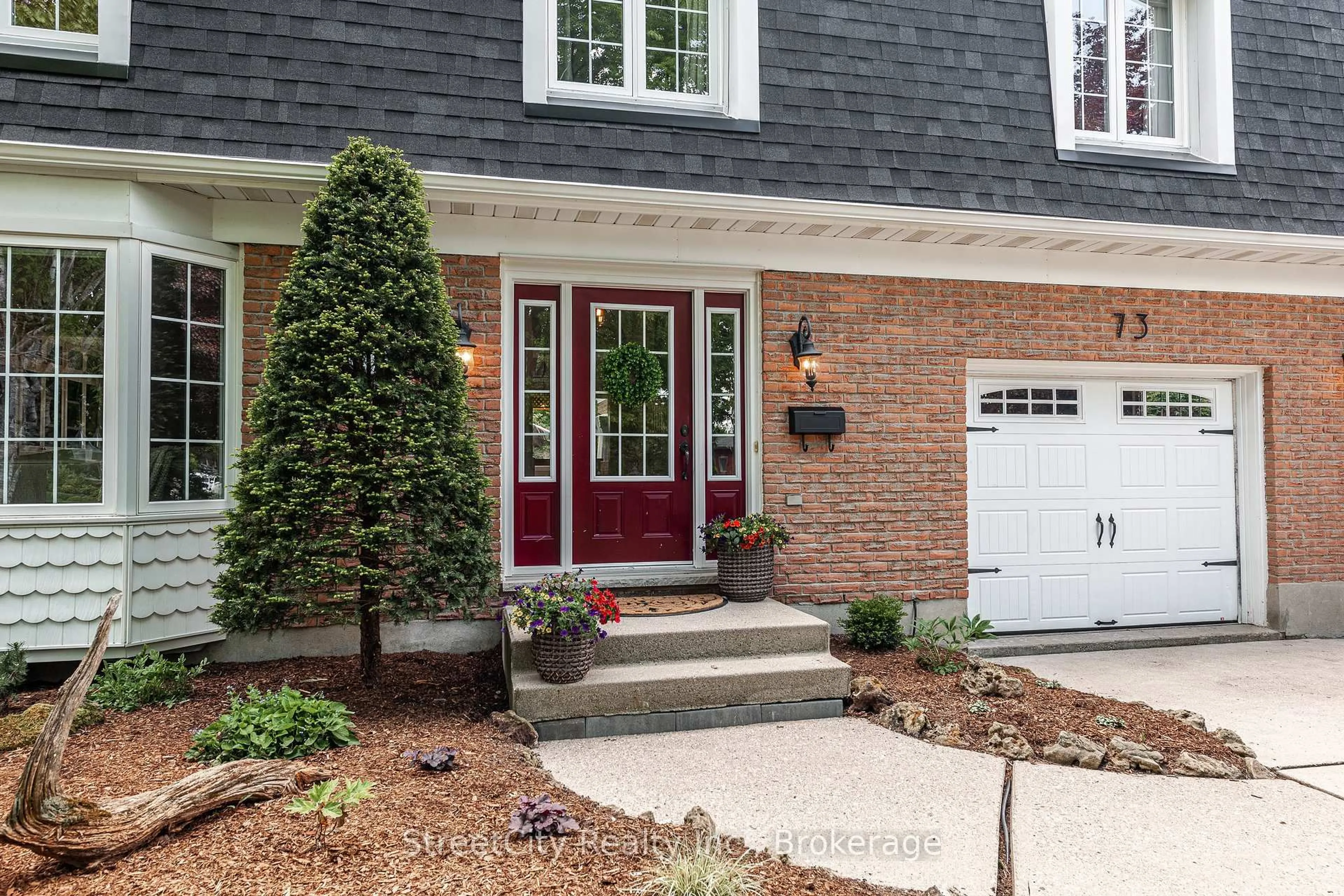 Home with brick exterior material, street for 73 Park Lane Dr, Stratford Ontario N5A 5C1