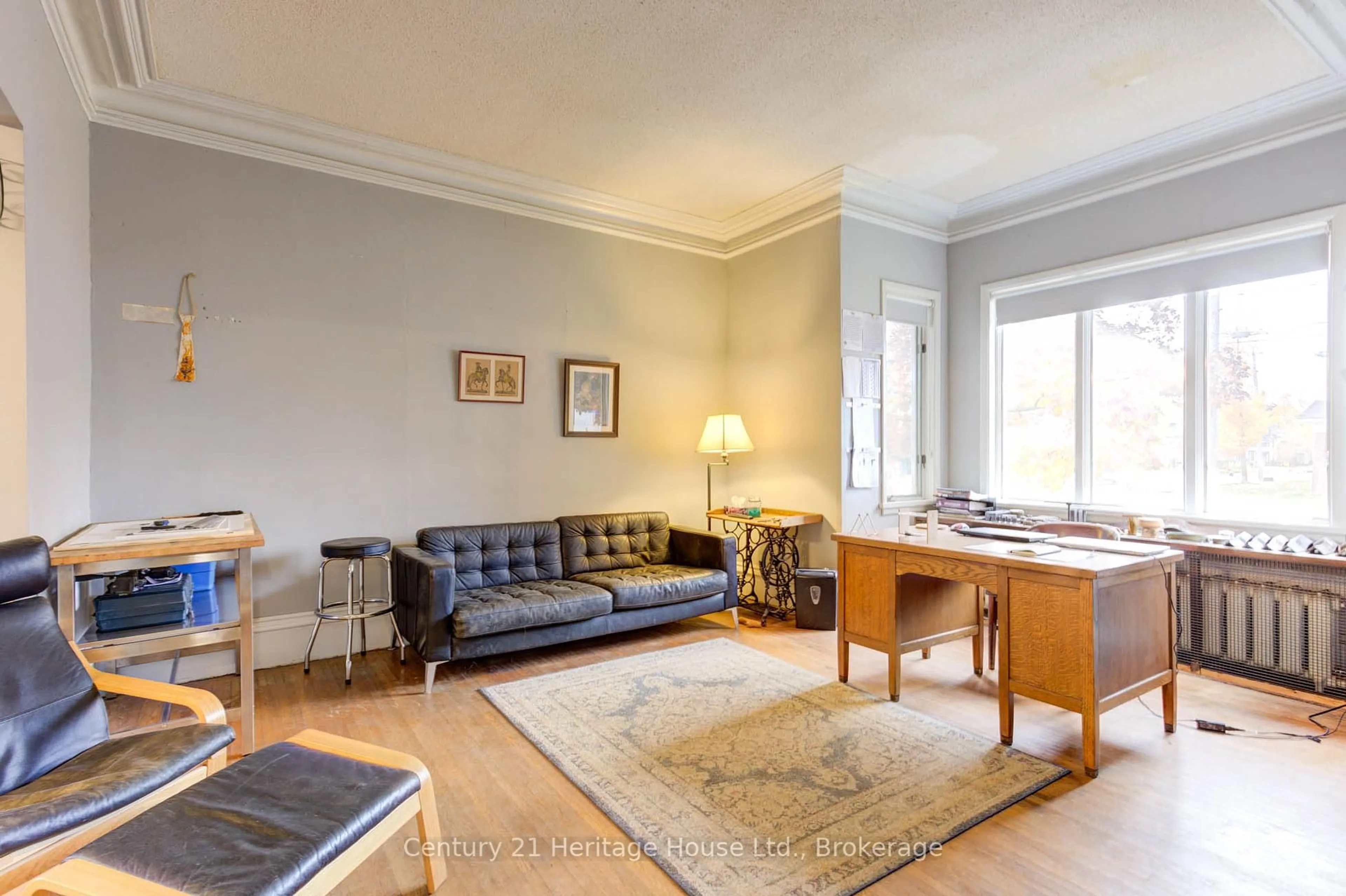 Living room with furniture, wood/laminate floor for 397 Lambton St, West Grey Ontario N0G 1R0