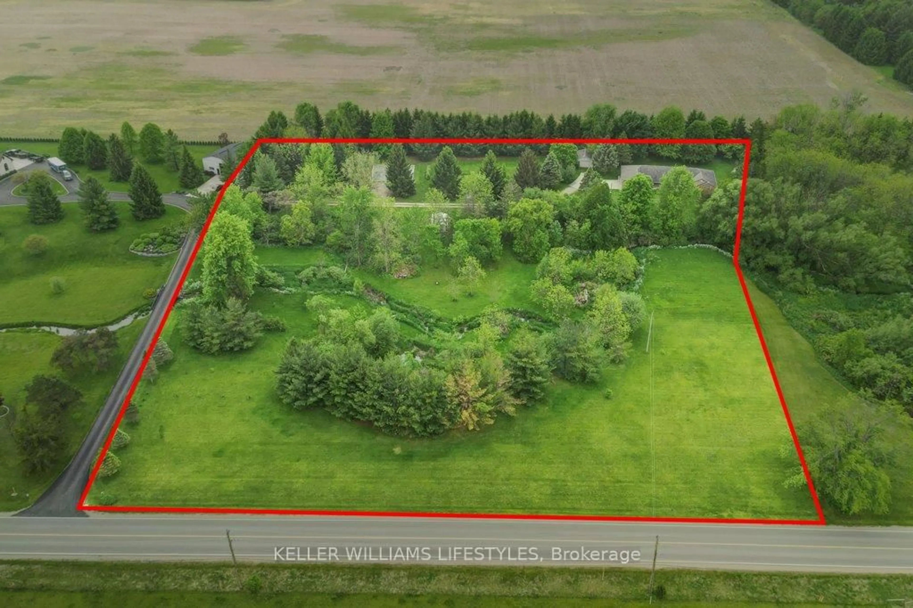 A pic from outside/outdoor area/front of a property/back of a property/a pic from drone, forest/trees view for 24317 Coldstream Rd, Middlesex Centre Ontario N0M 2A0