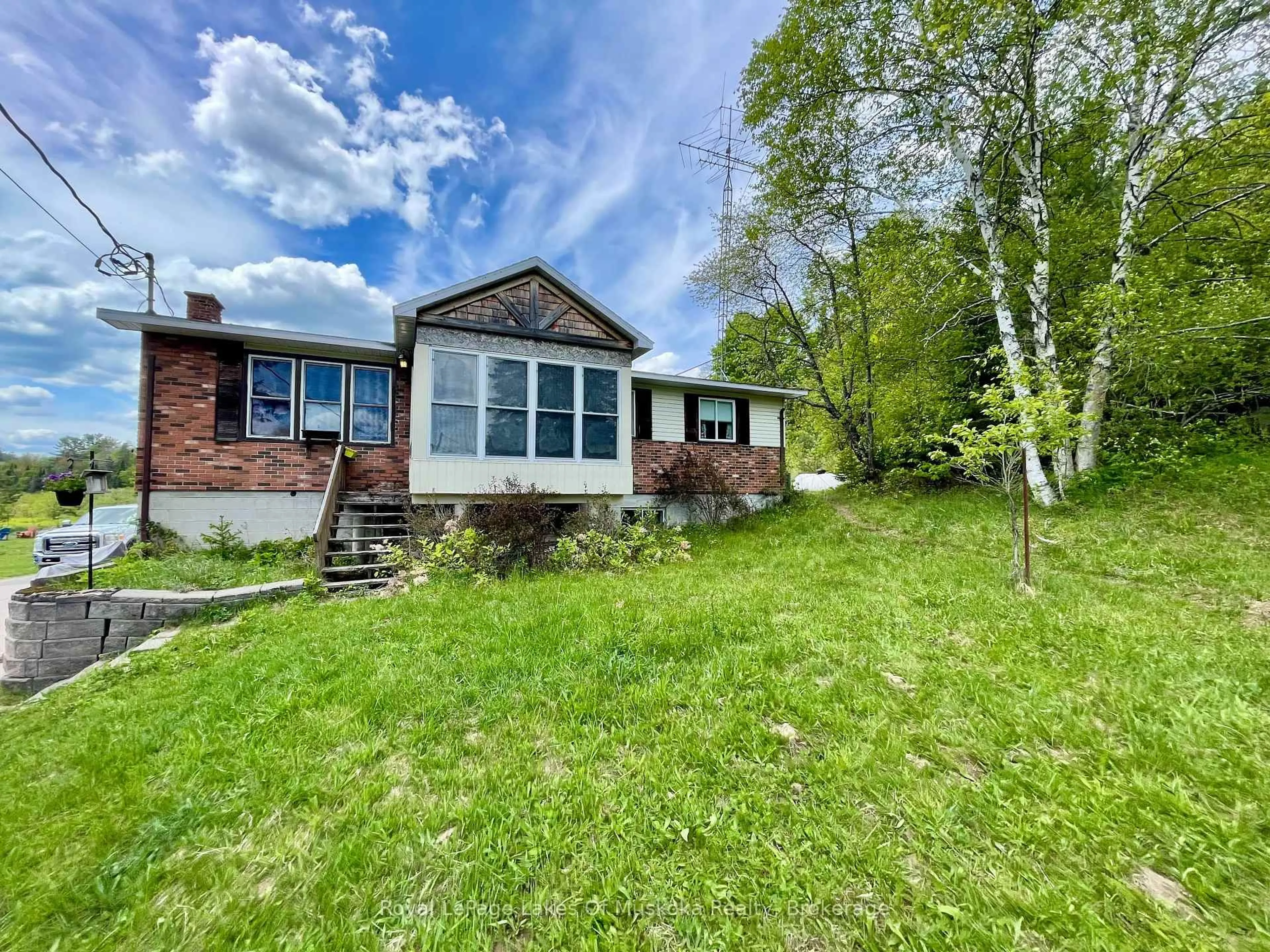 A pic from outside/outdoor area/front of a property/back of a property/a pic from drone, water/lake/river/ocean view for 1235 Bonnie Lake Rd, Bracebridge Ontario P1L 1W9