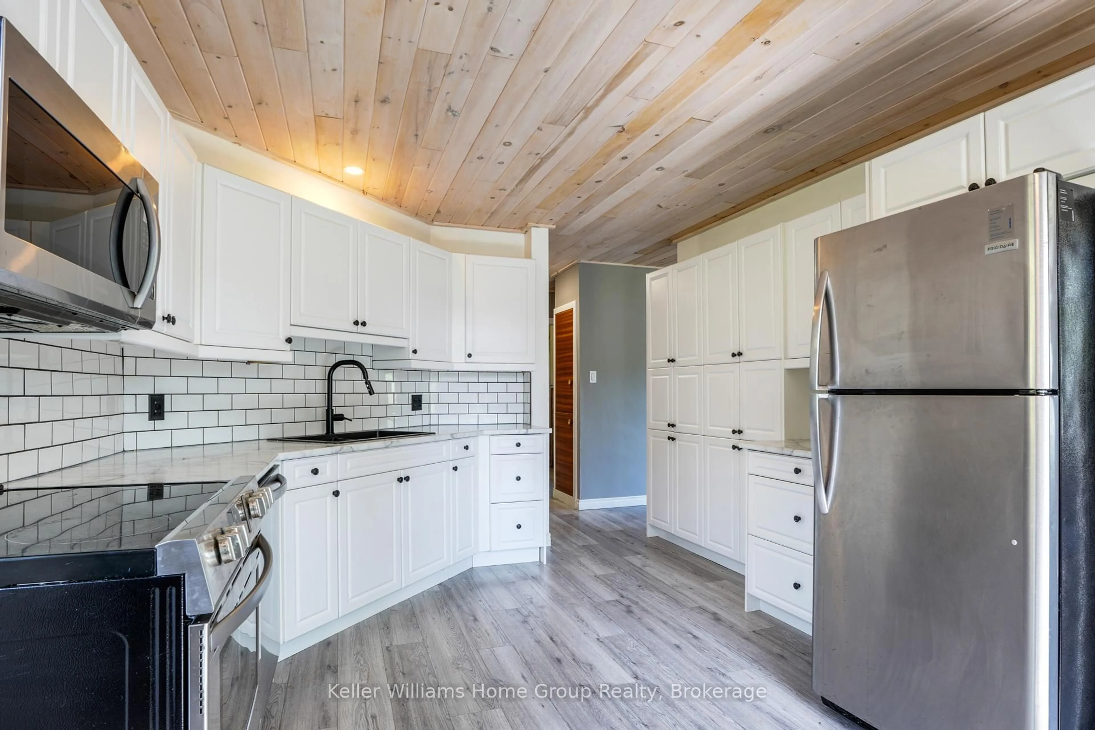 Open concept kitchen, wood/laminate floor for 311 CHEMAUSHGON Rd, Bancroft Ontario K0L 1C0